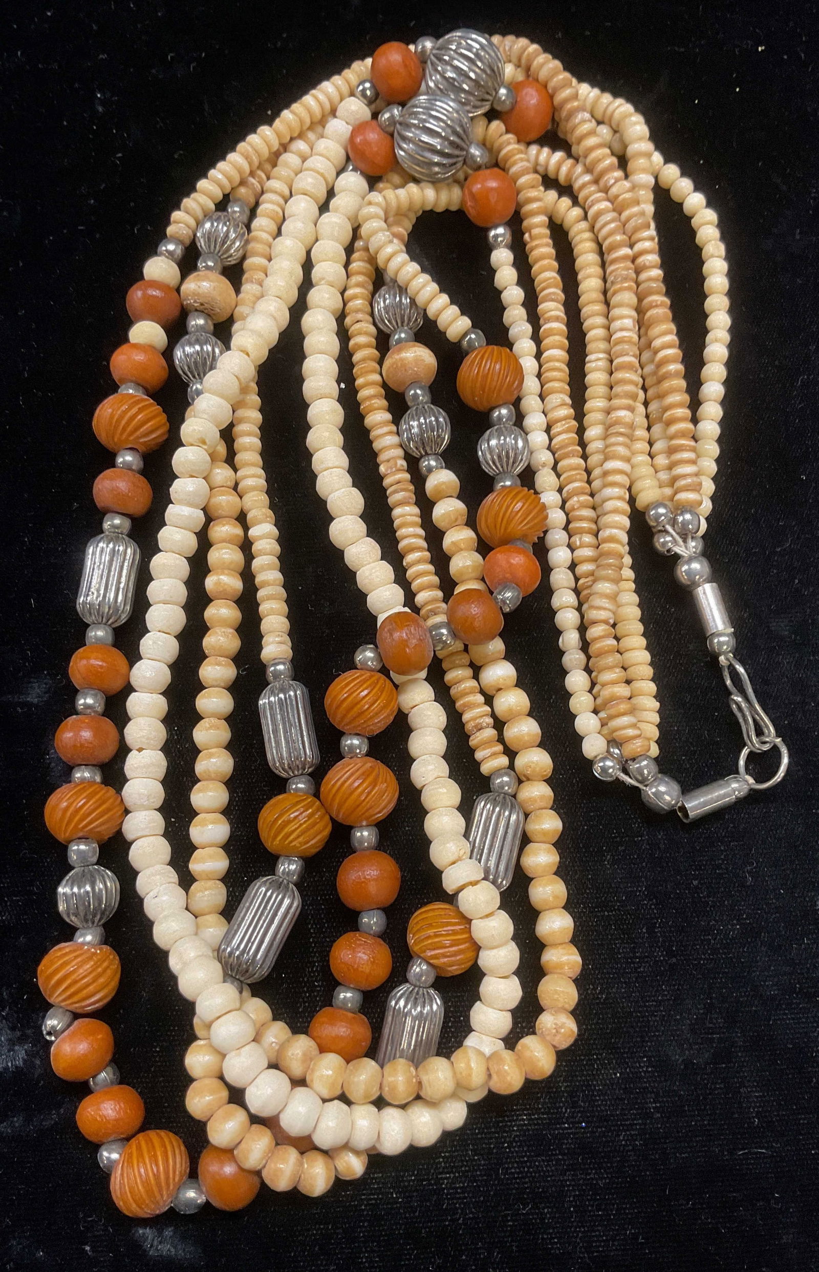 Vintage Silver Tn, Wood & Bone Beaded Necklace: Vintage silver tone, wood, and possibly bone beaded multi strand necklace. Drop length approx 14.5 inches. Some wear including scratching observed. Jewelry, estate jewelry, costume jewelry, cocktail j