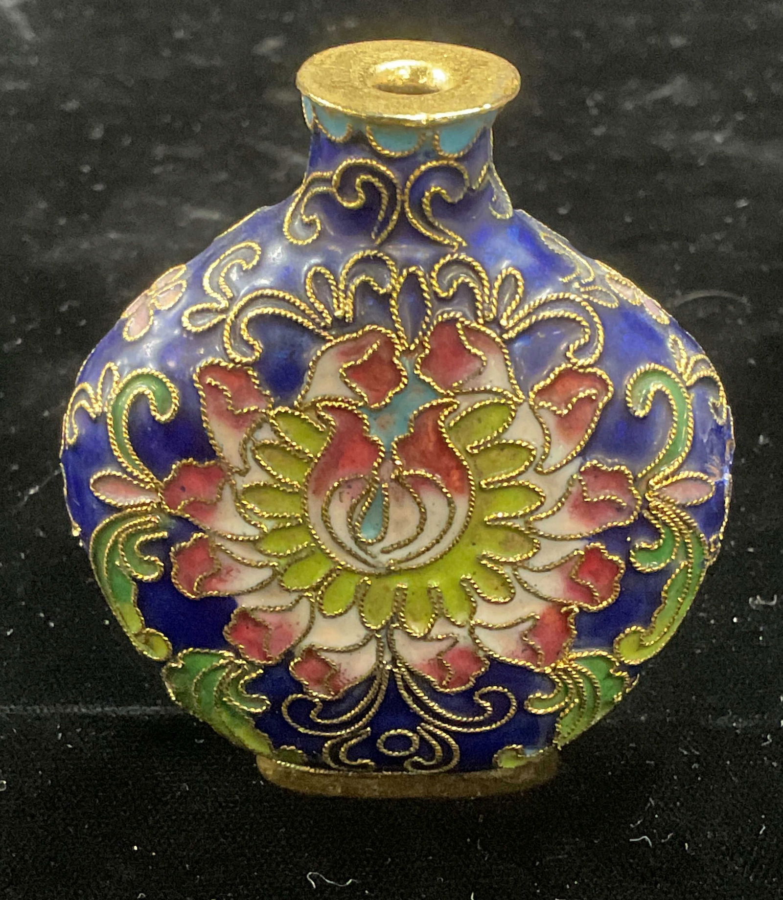 Vintage Enamel Cloisonne Floral Perfume Bottle: Vintage enameled brass cloisonne perfume bottle. Multicolor blue with floral design. Measures approx 2 x .75 x 2.5 inches. Some wear consistent with exposure. Perfume bottle, vintage perfume bottle, e