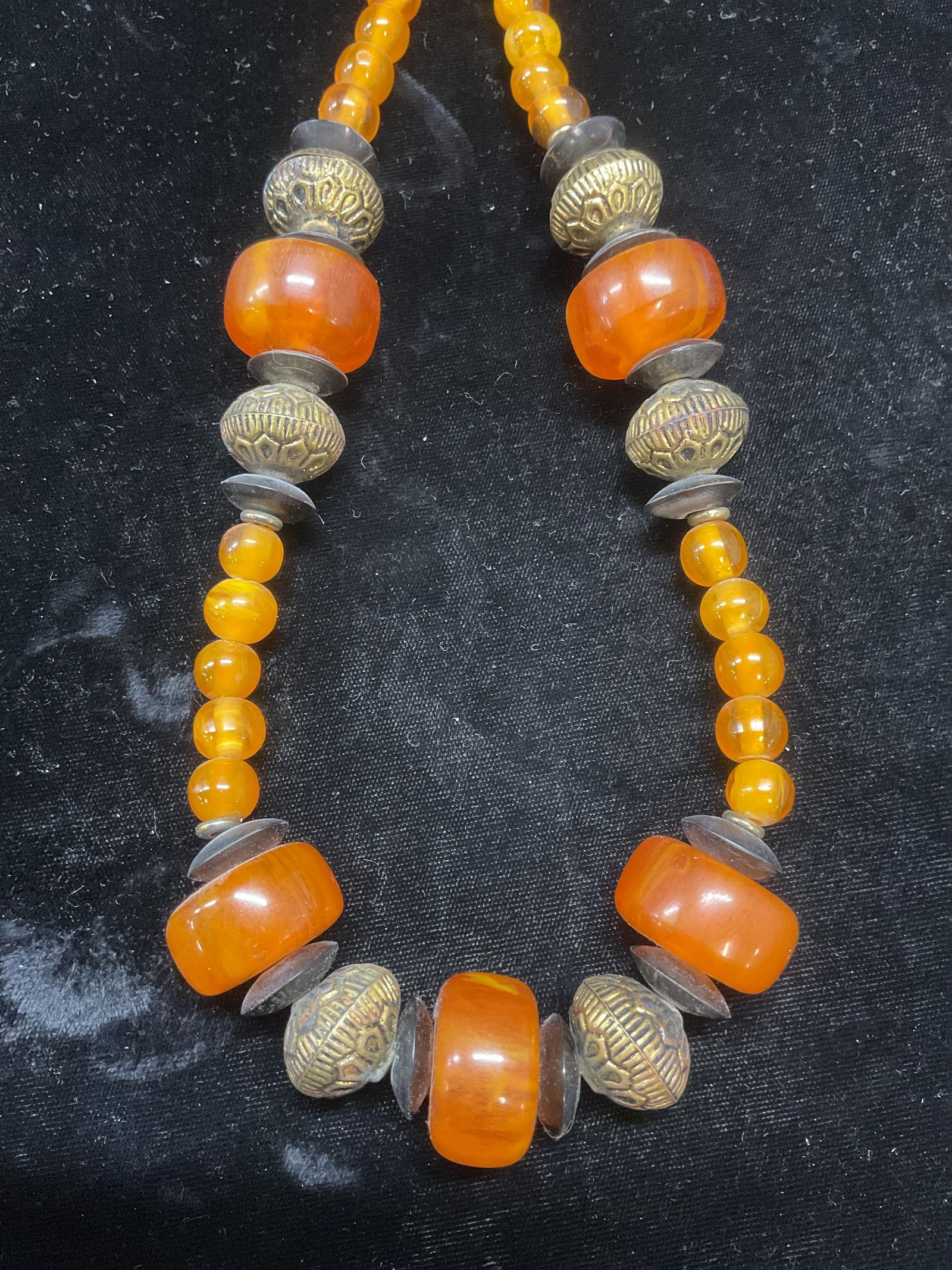 Vintage Gold Tone Amber Lucite Beaded Necklace: Vintage Amber lucite beaded necklace with gold tone and black accents. Drop length approx 13.5 inches. Some wear including scratching observed. Jewelry, estate jewelry, cocktail jewelry, fashion jewel