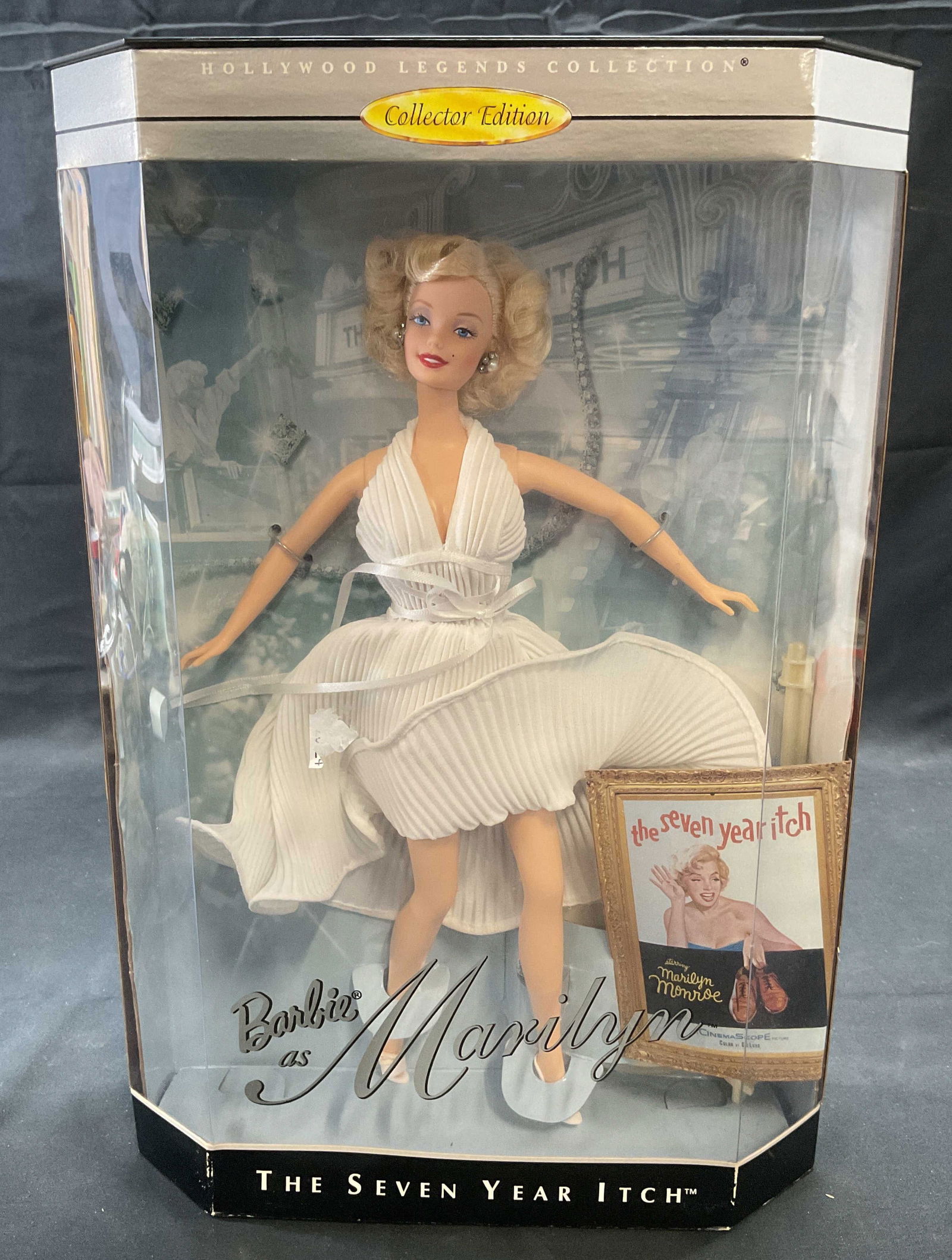 Mattel Barbie Marilyn Monroe Collectors 1997 NIB: Mattel Barbie Hollywood Legends series Collectors Edition Marilyn Monroe doll. New in box. Iconic The Seven year Itch white halter dress. Box measures approx. 9 x 3.25 x 13.5 inches. Not examined out