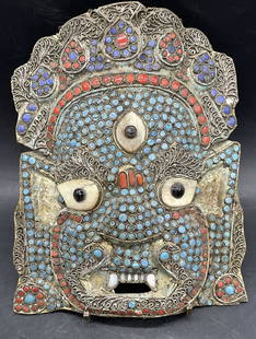 Vntg Tibetan Mahakala Three Eye Glass & Brass Mask: Vintage Tibetan Mahakala Three Eyes Brass & Glass Cabochon Mask. Lapis, Coral, Turquoise, and Onyx Toned Glass Cabochons Throughout. Bone, possibly horn, accents as well. Measures approx. 8.5L x