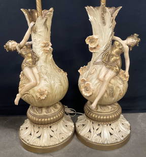 2 Auguste Moreau Female Figural Metal Table Lamps: Two Auguste Moreau Female Figural Metal Tabletop Lamps. Sides are signed Aug. Moreau. Comes with fabric lampshades. The lamps with their harps measure approx. 42H x 7.5W in. Weighty. Losses to