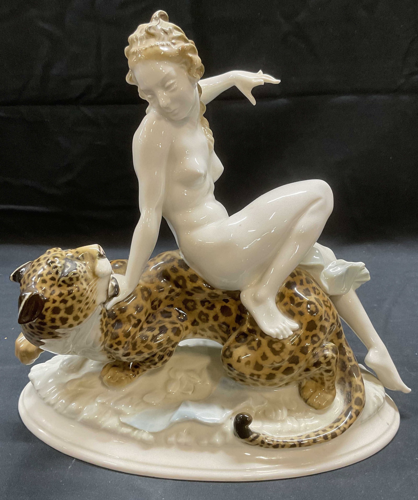 Vtg HUTSCHENREUTHER Woman & Leopard Figural German: Vintage HUTSCHENREUTHER porcelain figurine. Nude female figure seated on leopard. Signed K Tutter. Makers mark printed on underside. Made in Germany. Hand painted in white and brown. Measures approx 1