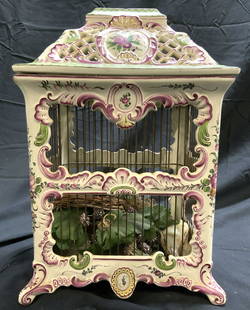 Antq French FAIENCE Porcelain Bird Cage: Underside is marked FRANCE. Birdcage appears to be antique possibly vintage. Piece is cream toned and porcelain with multi toned floral, leaf & scroll detail. Cage has pierced detail at top.