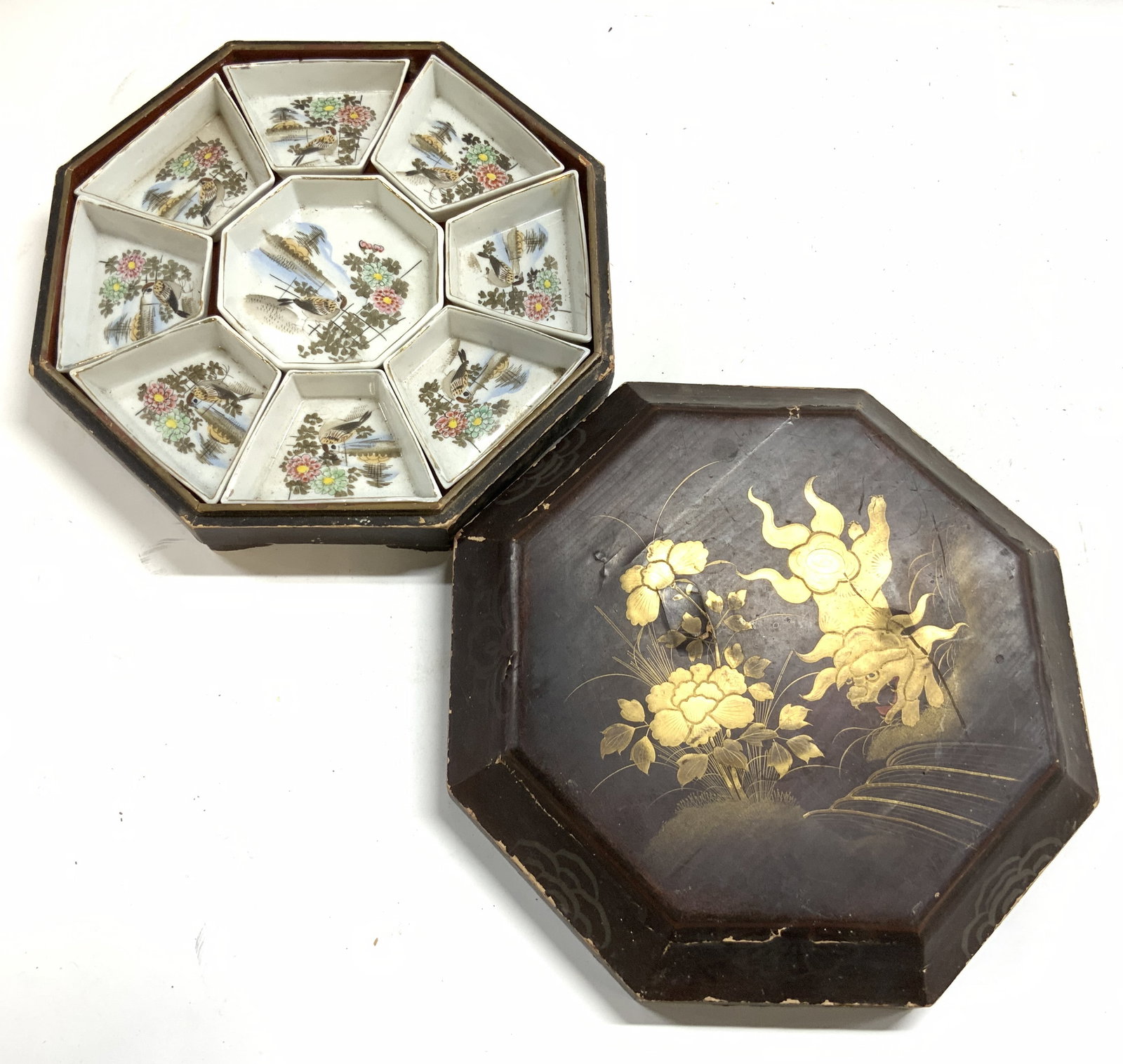 Vintage Wood & Porcelain Hors Doeuvres Set: Lot includes Hors Doeuvres set box, & porcelain Hors Doeuvres set with 9 pieces. Box has painted foo dog and floral detail. Porcelain dishes have intricate multi toned floral, leaf & bird detail with 