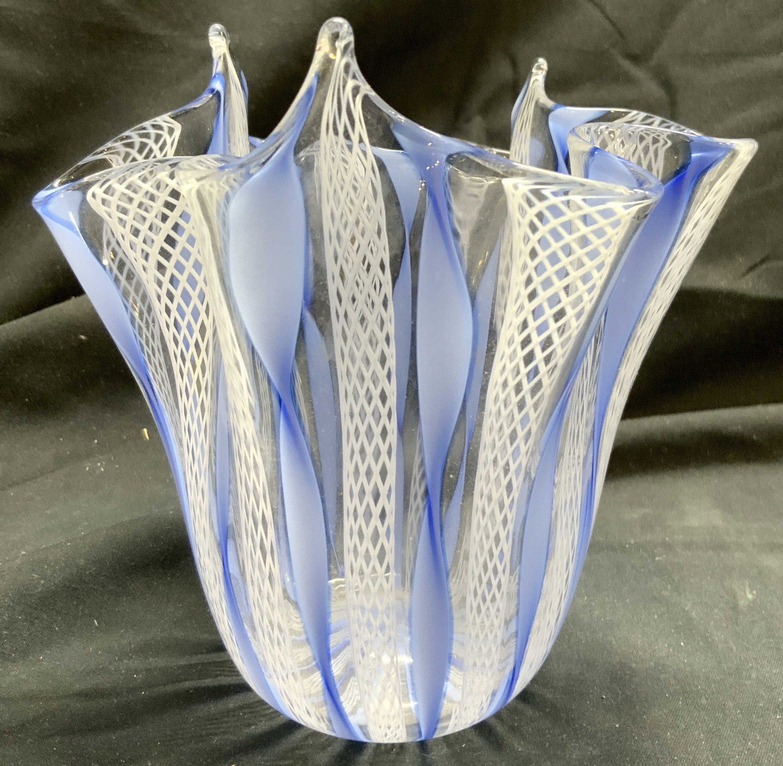 MURANO GLS ITALY LATTICINO Handkerchief Vase: Vase appears to be MURANO Glass (no apparent markings). Piece has handkerchief form. Vase has white and blue Latticino pattern detail. Vase appears to be hand blown due to pontil on underside. Vessel 