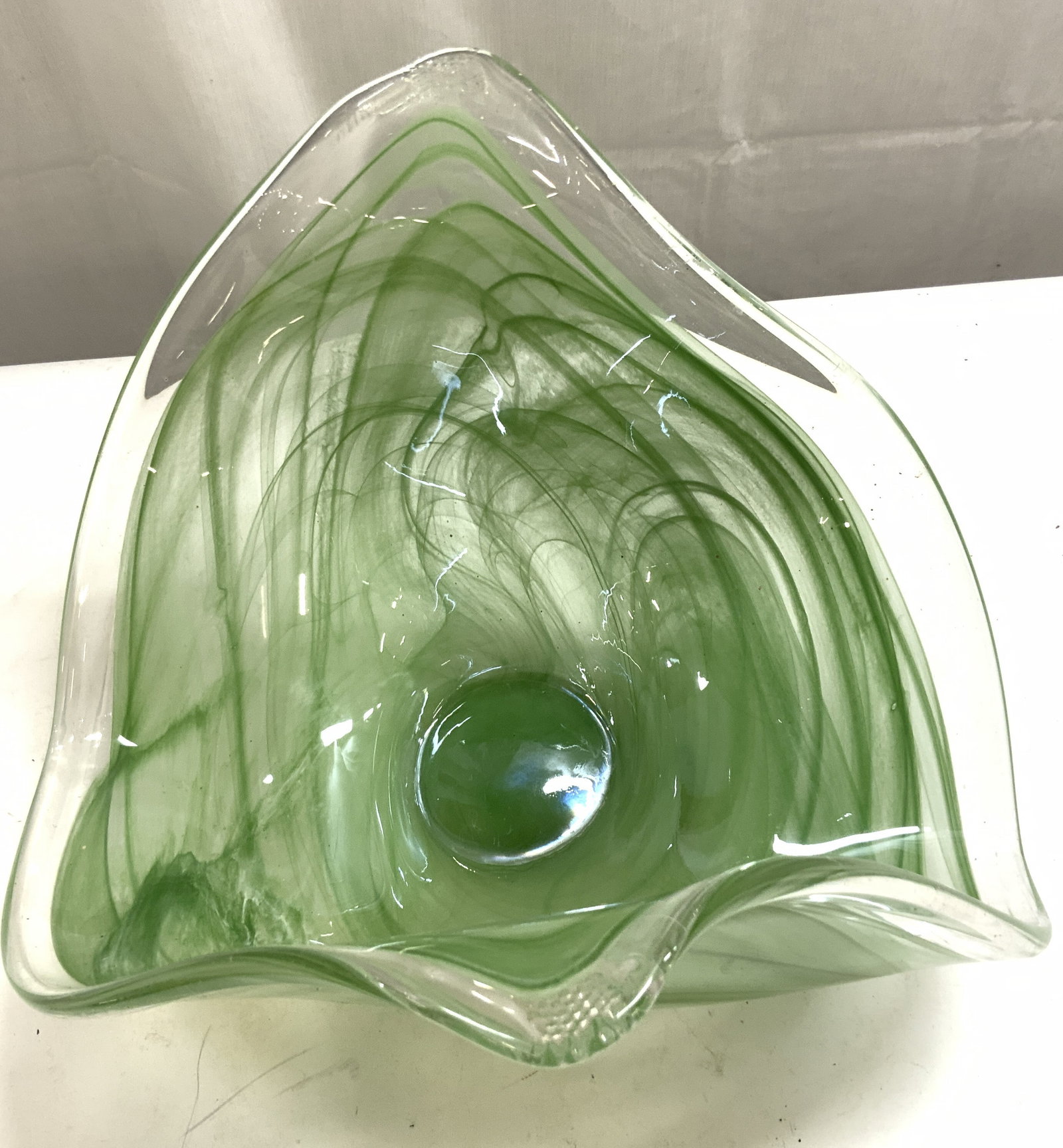 Hand Blown Murano Glass Bowl Green: Bowl appears to be MURANO Glass. Piece is green toned. Bowl appears to be hand blown possibly pulled. Art glass bowl has organic form. Piece measures approximately 9.25 inches tall 12.75 inches wide 1