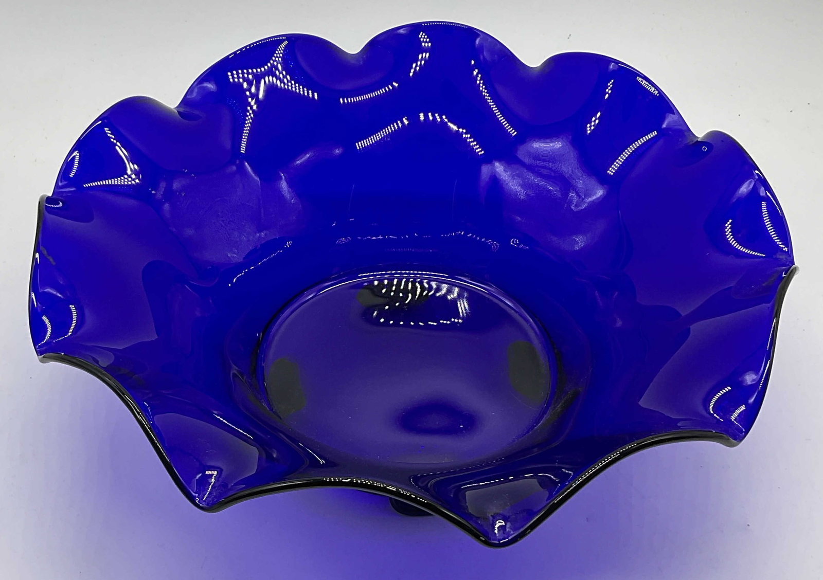 Vintage Cobalt Blue Ruffled Rim Art Glass Bowl: Vintage Cobalt Blue Ruffled Rim Art Glass Bowl. Footed. Measures approx. 4.5H x 12.25W in. Surface wear consistent with age, use, and exposure. Seam present. home decor, home accents, homewares, house