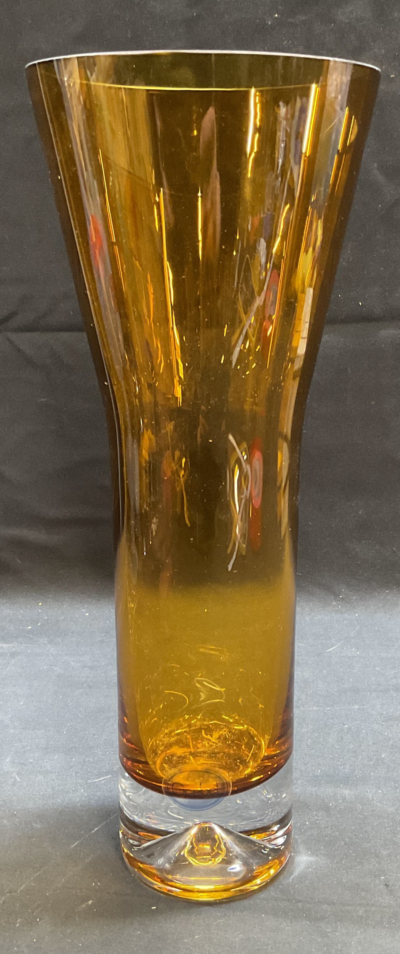 Vintage GOEBEL Amber Art Glass Fluted Vase: Vintage GOEBEL art glass vase. Fluted rim. Amber glass with clear glass base. Signed on label. Measures approx 4.25 x 11 inches. Some wear including scratching observed. GOEBEL, GOEBEL glass, GOEBEL v