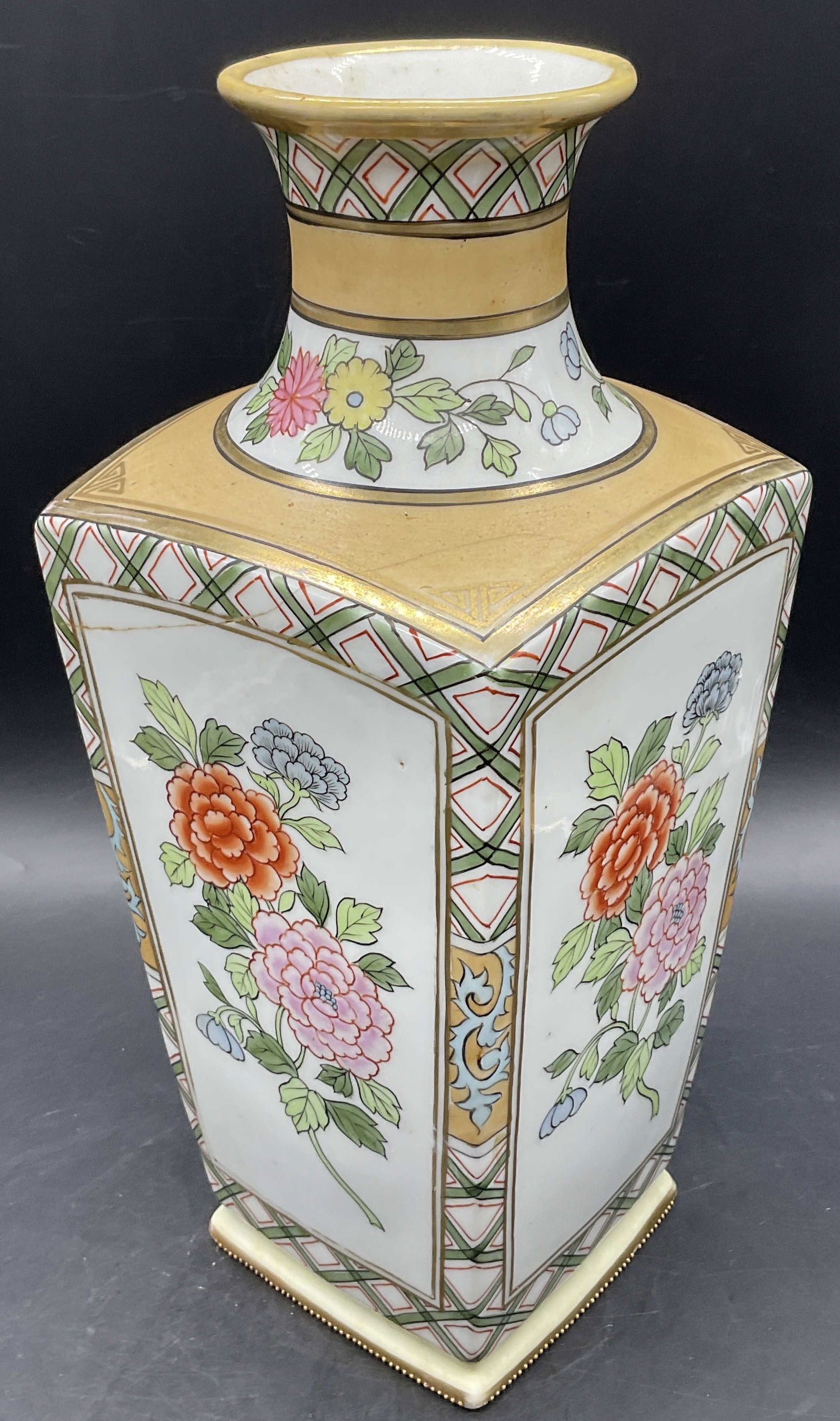 NIPPON Signed Hand Painted Asian Porcelain Vase: NIPPON Signed Hand Painted Asian Porcelain Vase. Multicolored floral and foliage motifs to the sides along with geometric patterns. Cracking, discoloration, pitting, and surface wear present. Appears