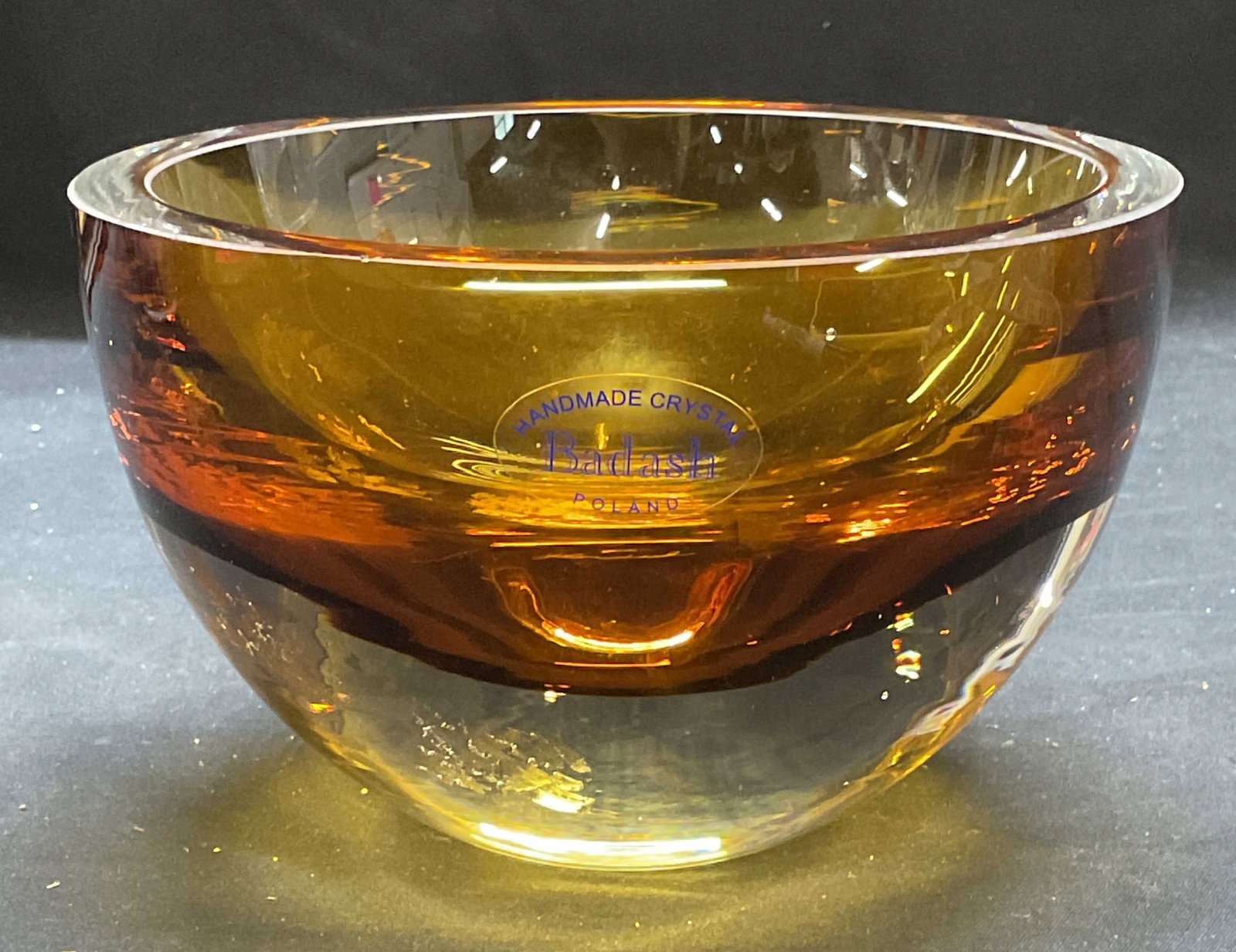 Badash Cased Amber Crystal Bowl, Poland: Badash handmade crystal bowl. Cased Sommerso amber and clear glass. Signed on label and underside. Made in Poland. Measures approx 6 x 3.75 inches. Thick wall crystal, piece has weight. Some wear incl
