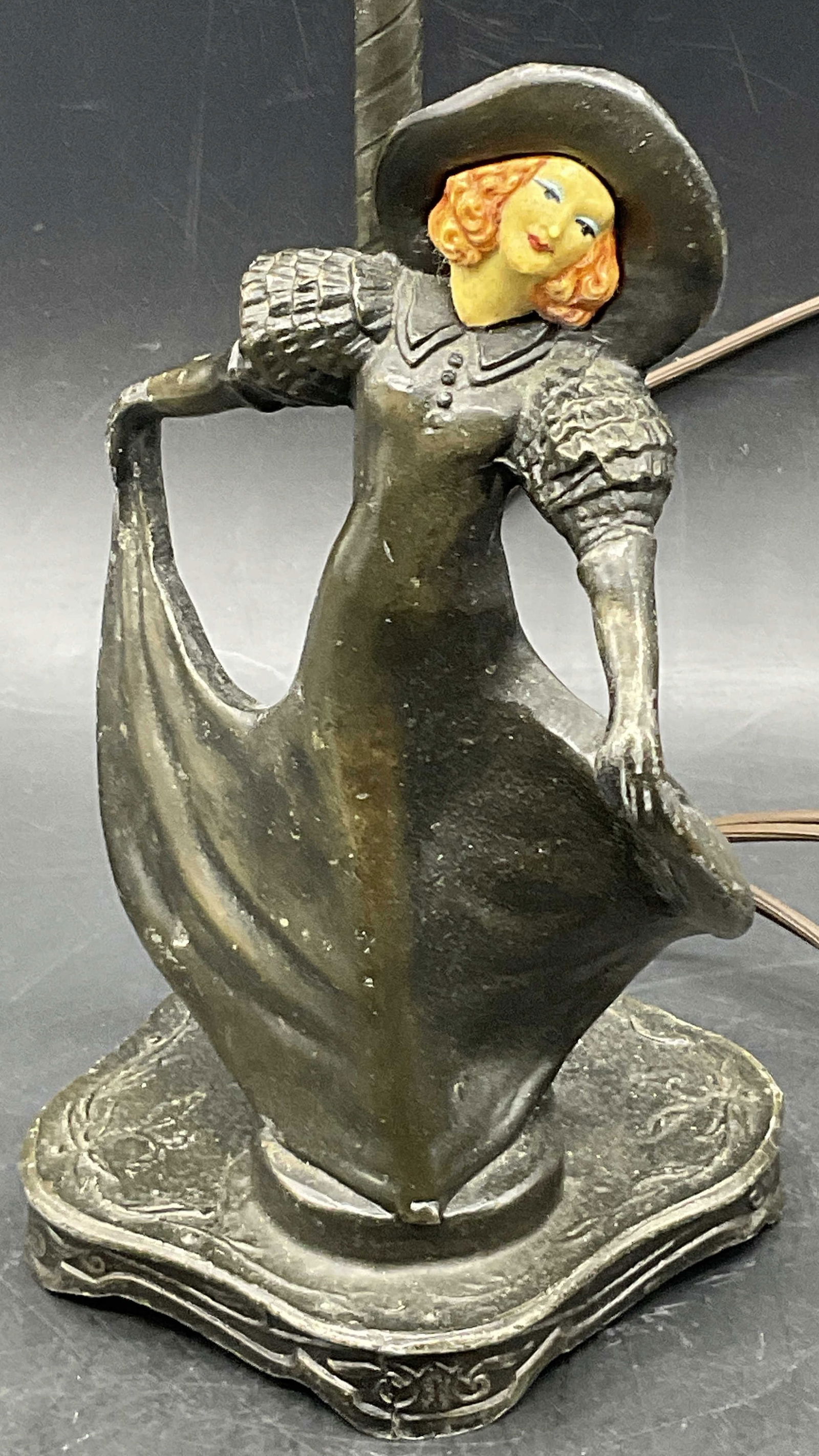 Emile Bruchon Bronze Art Nouveau Female Lamp: Emile Bruchon Bronze Art Nouveau Female Table Lamp. Female figural has a painted face. Trademarked on the underside, possibly Emile Bruchon. Crafted from metal, appears to be bronze. Frosted glass lam