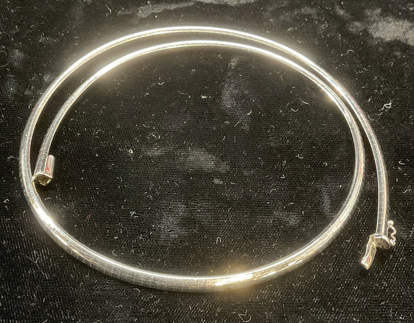 14k White Gold Omega Chain Necklace, Italy: 14k white gold omega chain necklace. Flat plate chain. Marked 14k on clasp. Made in Italy. Drop length approx 6 inches. Total weight 17.2 dwt. Some wear including scratching observed. Jewelry, fine je