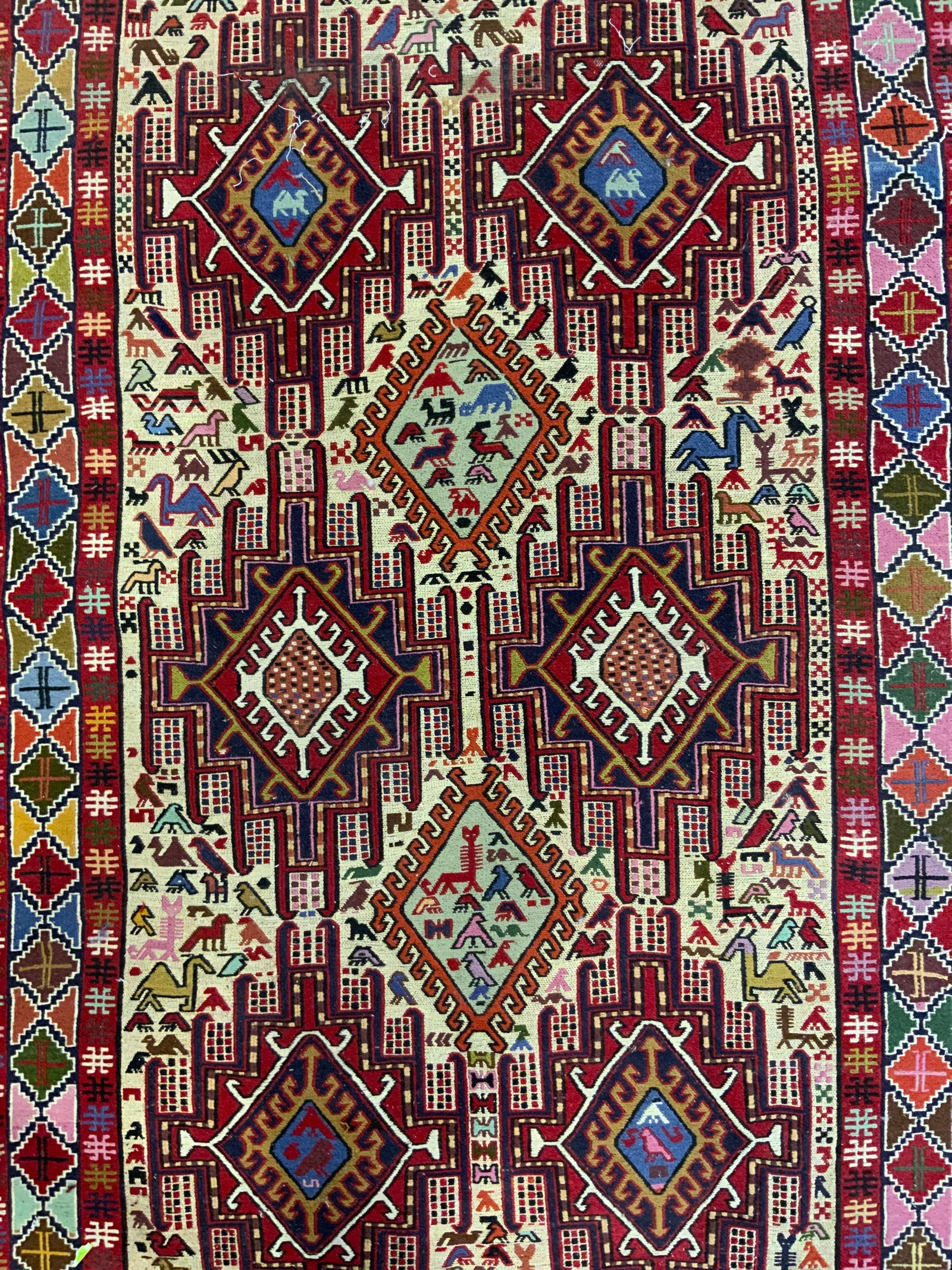 Soumak Kilim Vintage Handwoven Wool Area Rug: Rug is handmade and wool. Piece appears to be Soumak Kilim. Rug has intricate multi toned geometric detail. Rug is vintage. Piece has cream toned fringes at edges. Area rug measures approximately 79 i