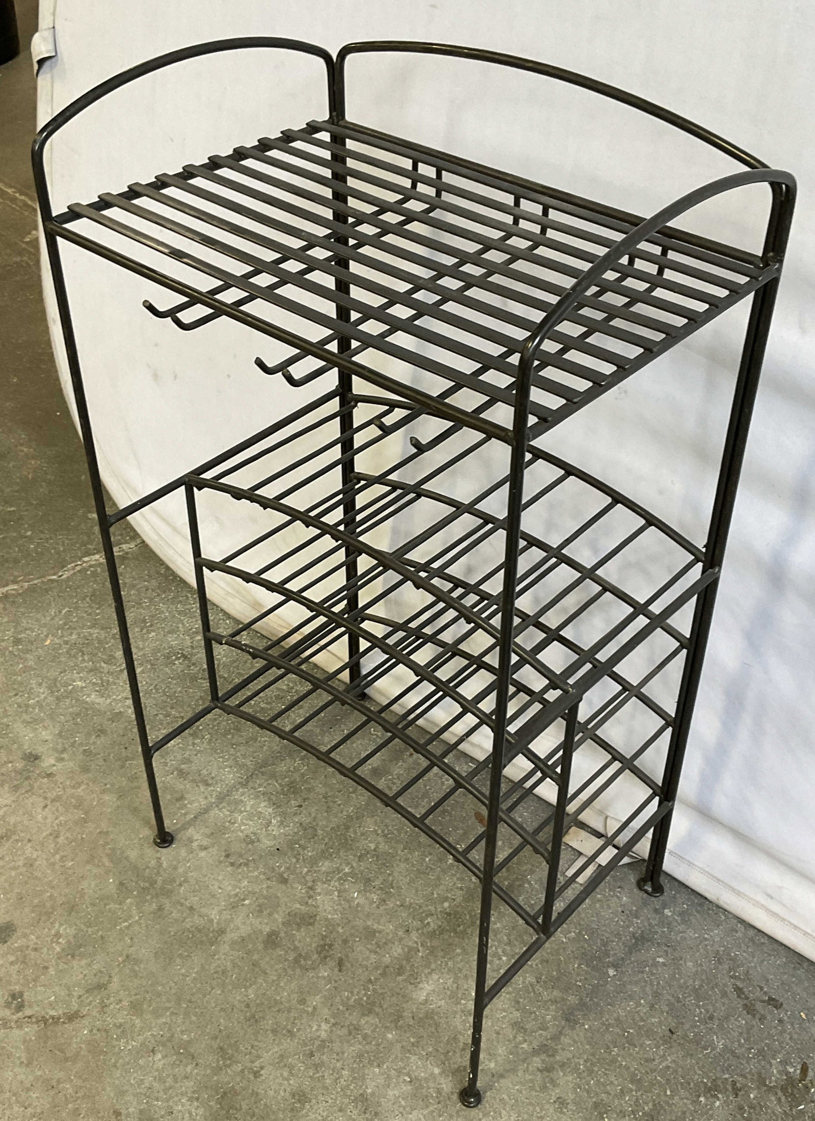 Black Metal Wine Rack / Bar Rack: Black Metal Wine Rack / Bar Rack. Piece has space for storing bottles and glasses. Measures approx. 20W x 14D x 36H in. Surface wear, discoloration, and residue present. Furniture, furnishings, Barwar