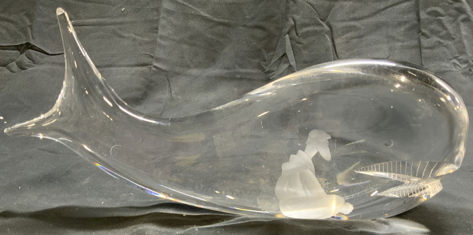VICKE LINDSTRAND KOSTA BODA JONAH & THE WHALE: Piece appears to be by VICKE LINDSTRAND for KOSTA BODA. (No apparent markings). Piece appears to be Crystal possibly glass. Depicts frosted etched male figure (Jonah) within structure of whale. Piece