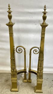 Pair Vintage Ornate Brass Fireplace Andirons: Pair Vintage Ornate Brass Fireplace Andirons. Scrolled and raised metalwork throughout the pieces. Weighty. Measures approx. 32.5H x 5.75W x 7D in. Separation, loose pieces, surface wear, and discolor