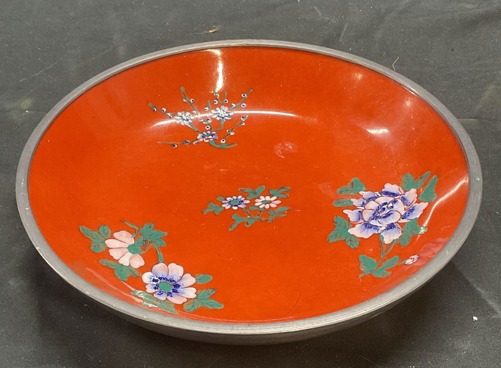 B Altman Japanese Porcelain Pewter Covered Dish: Vintage B Altman & Co Japanese porcelain dish with pewter covered exterior. Signed on underside. Hand decorated. Red with floral design in pink and purple. Measures approx 7.5 x 1.5 inches. Piece has