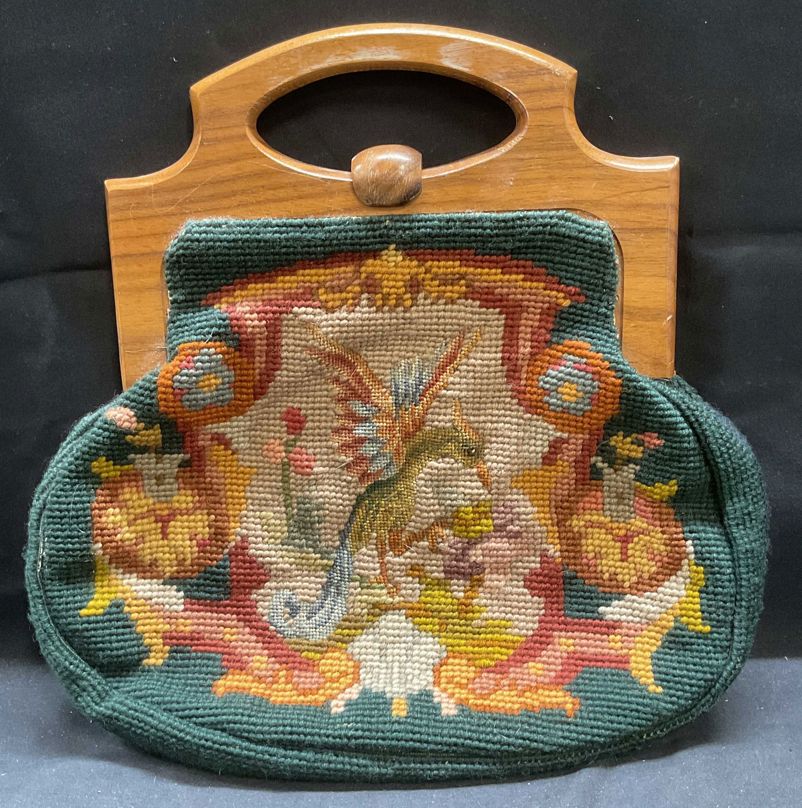 Vintage RB Ingham Needlepoint Handbag: Vintage R. B. Ingham handbag. Needlepoint tapestry in green and red with Phoenix design. Signed on interior. Numbered on interior handle. Wood handle and latch. Measures approx 11 x 10 inches, includi