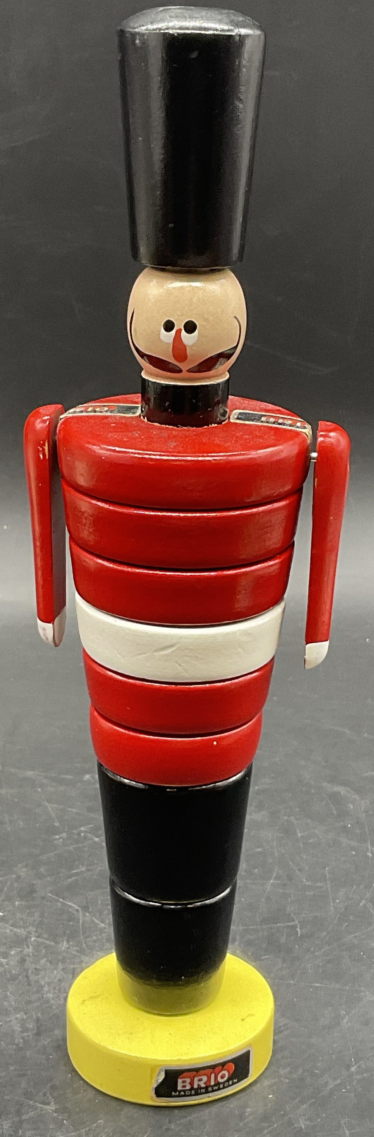 BRIO SWEDEN Vintage Soldier Stacking Toy: BRIO SWEDEN Vintage Soldier Stacking Toy. Hand painted and crafted from wood. Primarily red, black, white, and yellow hues. Underside, obverse, and shoulders read BRIO. Underside reads BRIO MADE IN SW