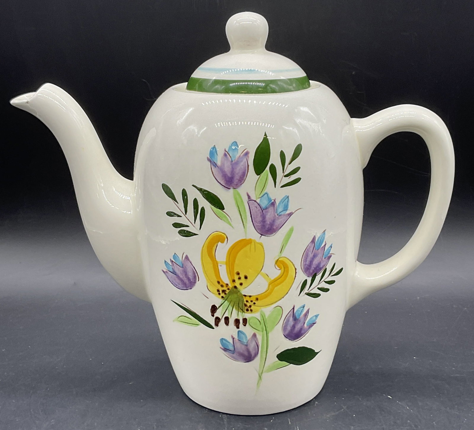 STANGL POTTERY COUNTRY GARDEN Floral Teapot, Lid: STANGL POTTERY COUNTRY GARDEN Floral Teapot. Lidded. The obverse and reverse feature colorful hand painted florals and foliage. The lid is painted with strips. Underside reads STANGL POTTERY, TRENTON 