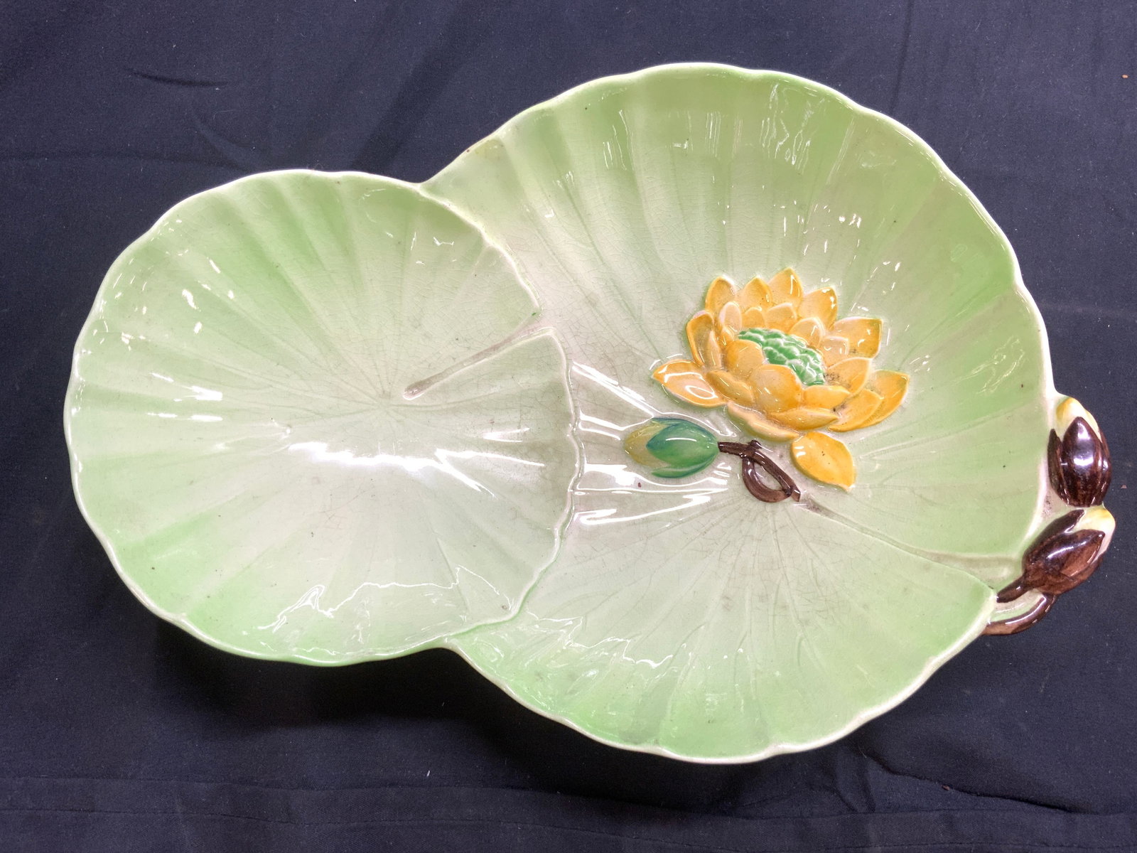 CARLTONWARE Porcelain Lilypad Bowl ENGLAND: Underside is marked CARLTONWARE MADE IN ENGLAND. Bowl appears to be porcelain possibly ceramic. Piece has Lily pad and floral form. Bowl measures approximately 10.5 inches long 7.5 inches wide 2.5 inc