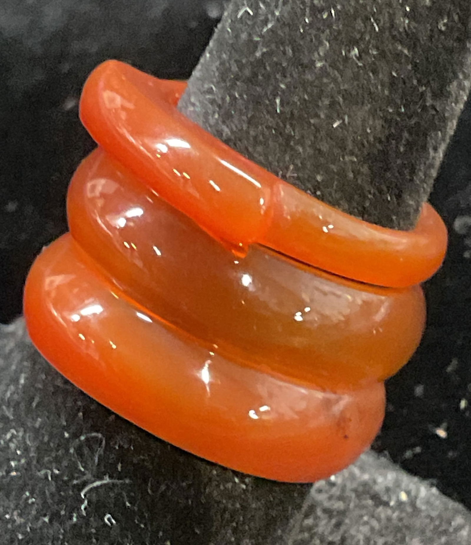 Lot 3 Carved Orange Semiprecious Rings: Lot of 3 carved orange semiprecious stone rings. Largest ring size 7.5. Some wear to all including scratching observed. Jewelry, estate jewelry, fine jewelry, cocktail jewelry, fashion jewelry, access