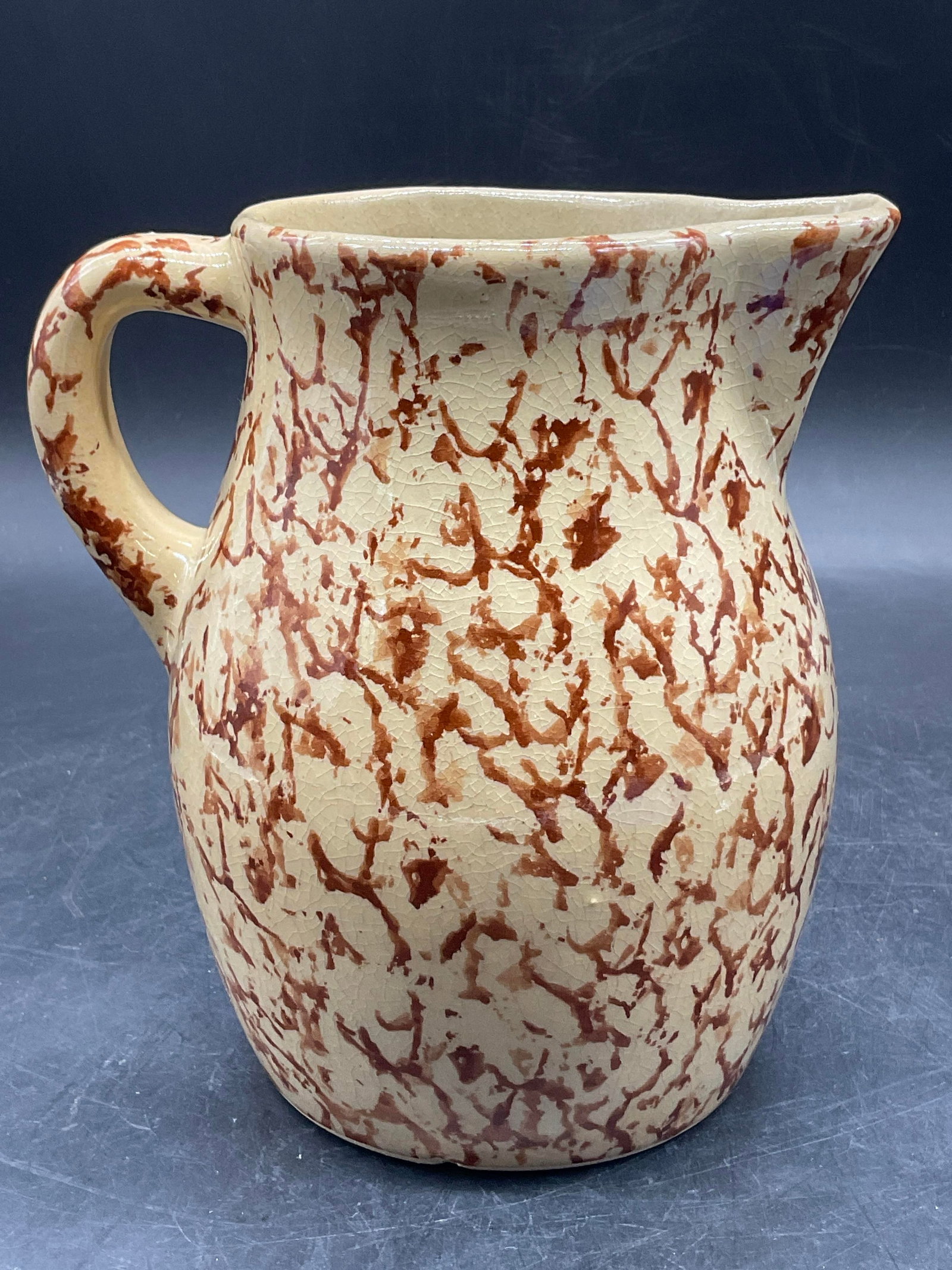 Vintage Spongeware Pottery Pitcher: Vintage Spongeware Pottery Pitcher. Brown and cream hues. Measures approx. 5.5W x 6.25H in. Measured at widest point. Crazing, chipping, and surface wear present. home decor, home accents, homewares, 