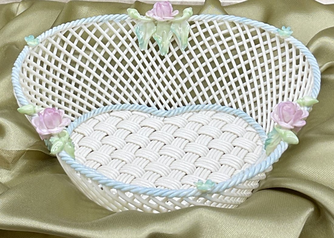 BELLEEK IRELAND Woven Porcelain Floral Basket, Bx: BELLEEK IRELAND Woven Porcelain Floral Basket. Underside signed BELLEEK R IRELAND. Contained in original box, reads BELLEEK. The box measures approx. 9.5L x 9.25W x 3.75H in. Surface wear consistent w