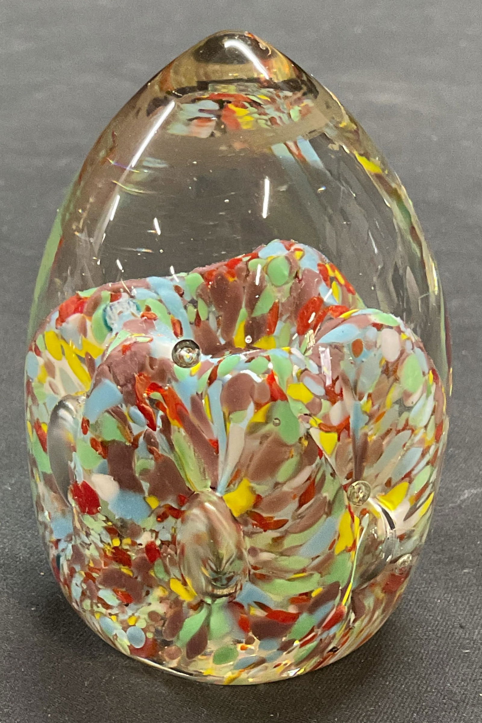 Hand Blown Multicolor Art Glass Egg Paperweight: Hand blown art glass paperweight with multicolor design. Egg shape. Measures approx 3.25 inches tall. Some wear including scratching observed. Art glass, art glass paperweight, paperweight, decorative