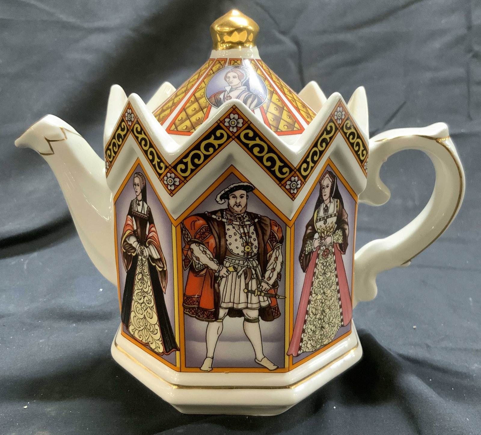 SADLER KING HENRY VIII & HIS 6 WIVES Porc Teapot: Underside of teapot reads SADLER KING HENRY VIII & HIS 6 WIVES. Piece depicts male and female figures. Teapot includes lid. Measures approx 6 inches tall 7 inches deep 4 inches wide. Teapot, porcelain