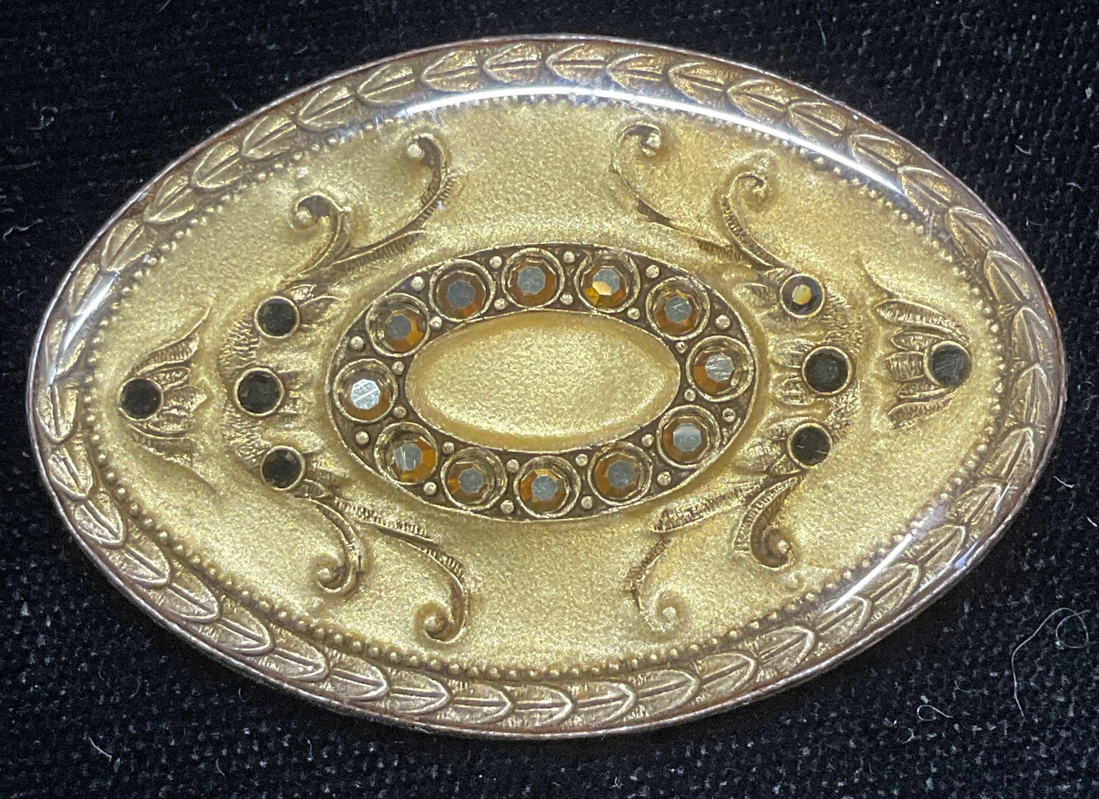 Vintage Yellow Lacquered Scroll Crystal Brooch: Vintage oval shaped silver tone brooch with yellow lacquer covered scroll motif and crystal. Measures approx 1.75 x 1.25 inches. Some wear including scratching observed. Jewelry, estate jewelry, costu