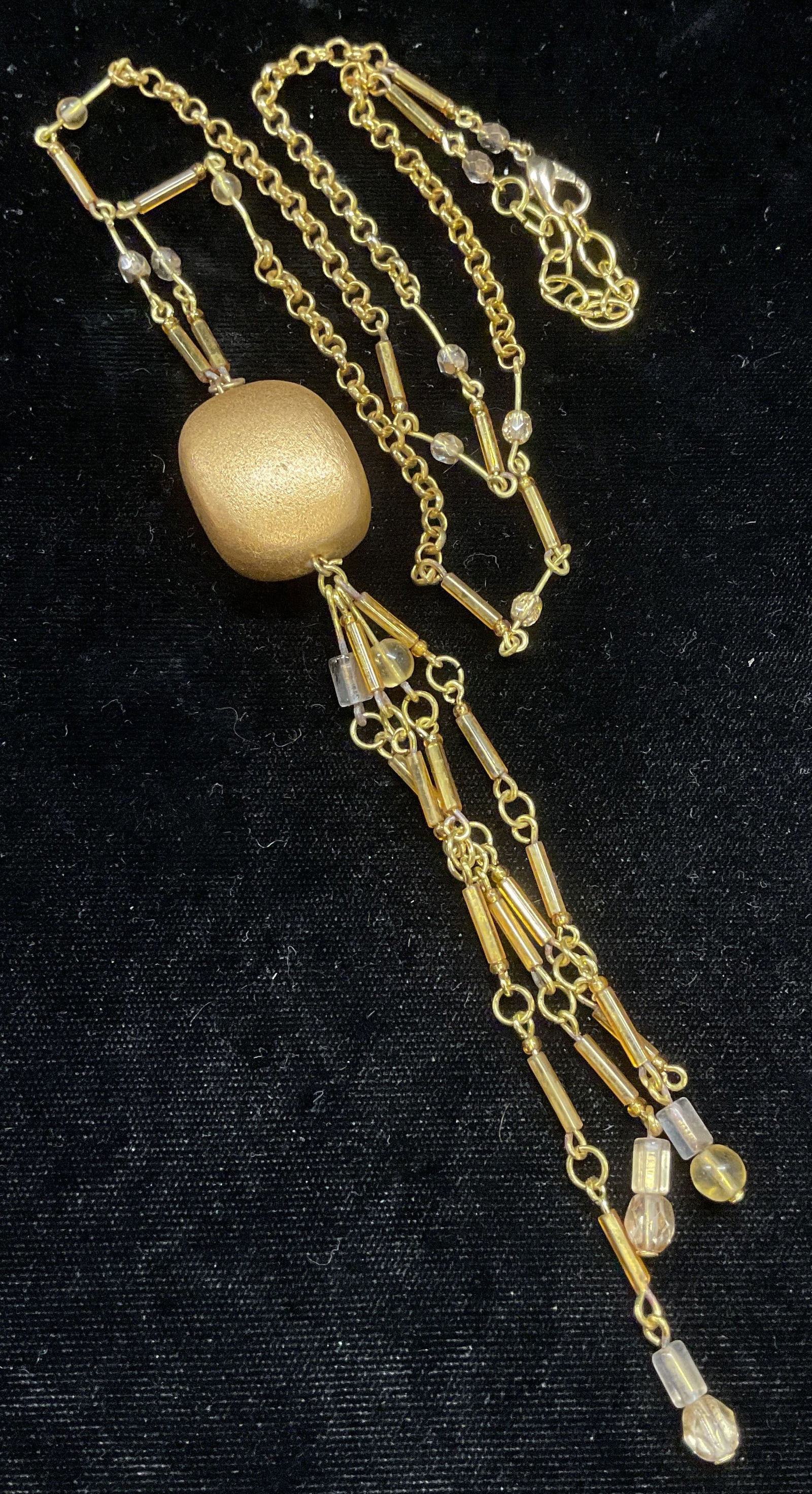 Vintage Gold Tone Beaded Pendant Necklace: Vintage gold tone pendant necklace with beaded decoration. Drop length approx 12 inches, pendant drop approx 5.5 inches. Some wear including scratching observed. Jewelry, estate jewelry, costume jewel