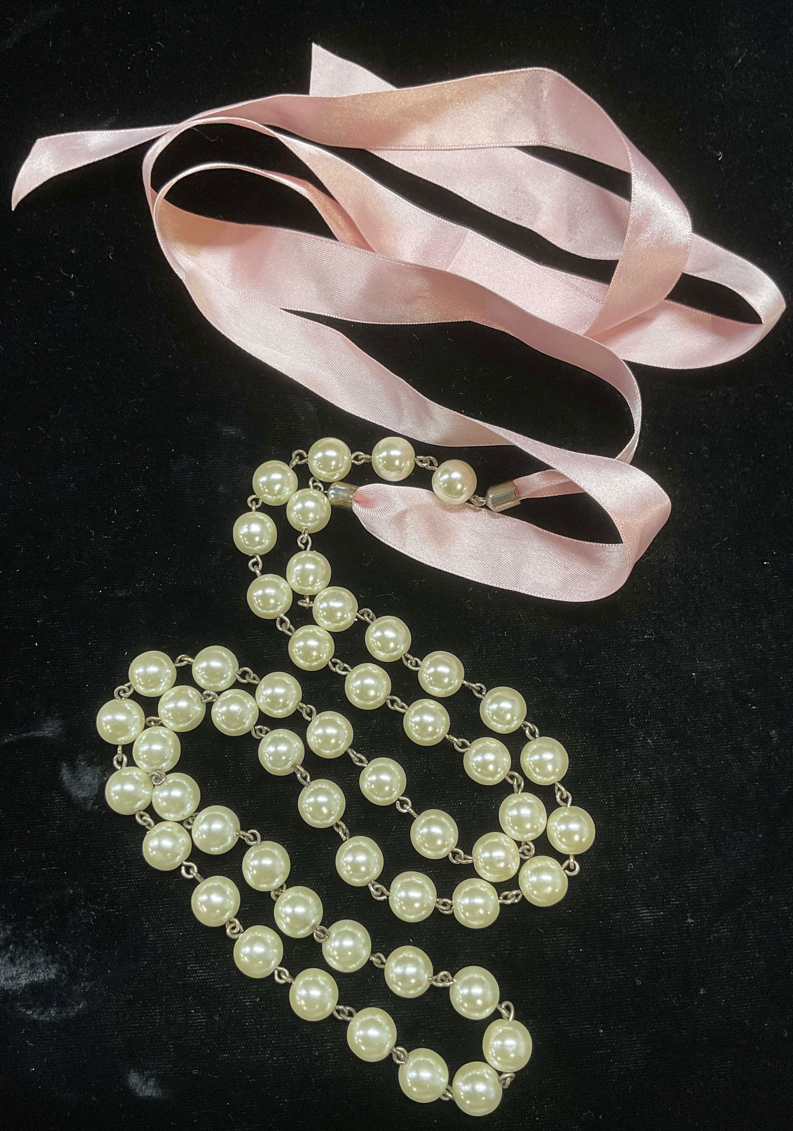 Faux Pearl Beaded Pink Ribbon Necklace: Faux pearl beaded silver tone necklace with pink ribbon. Total drop length approx 40 inches. Some wear including scratching observed. Jewelry, estate jewelry, costume jewelry, cocktail jewelry, fashio