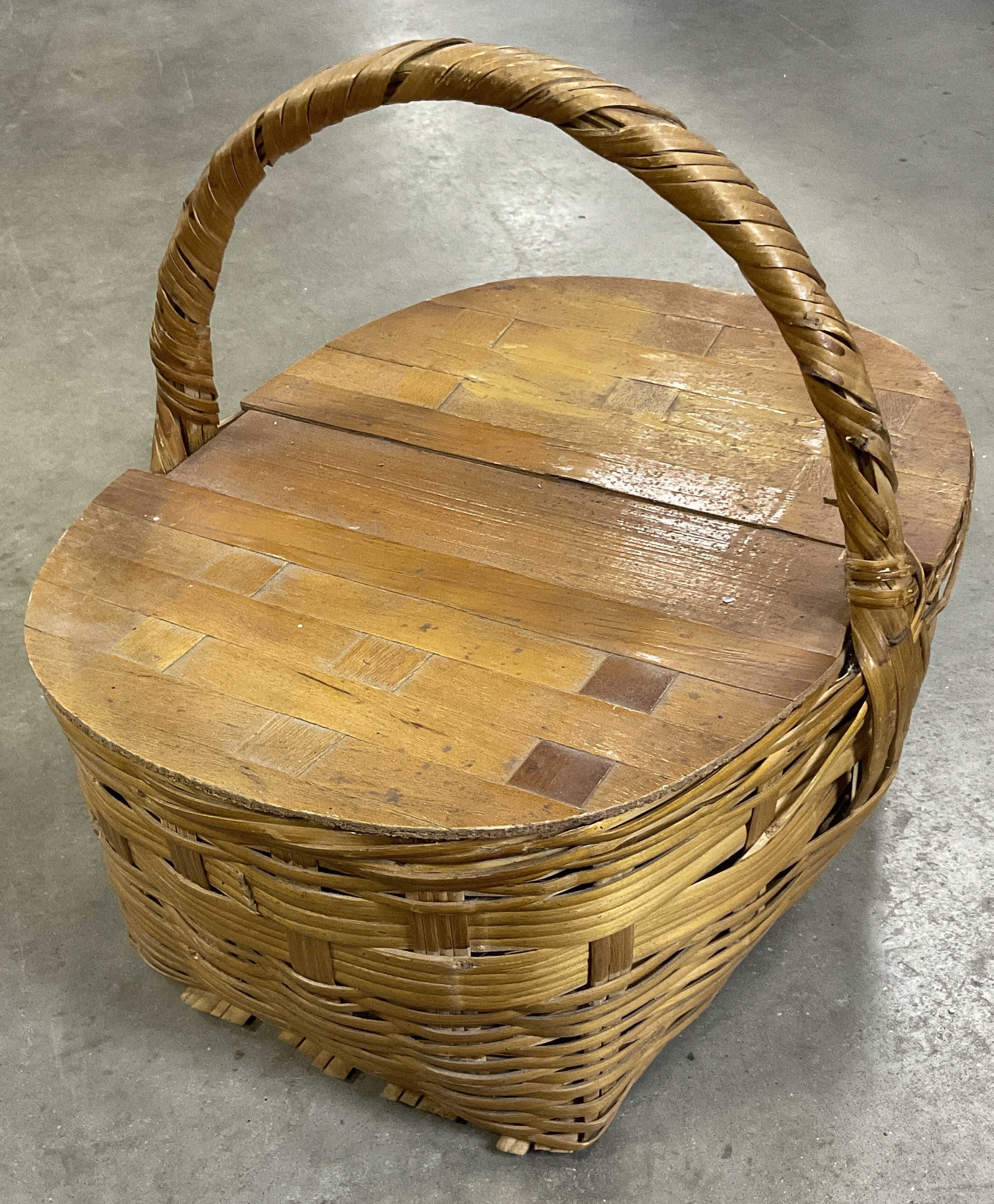 Vintage Woven Top Handle Picnic Basket, Lid: Vintage Woven Top Handle Picnic Basket. Lid flips open. Measures approx. 14H x 16.5W in. Surface wear, losses, and discoloration present. home decor, home accents, homewares, housewares, home accessor