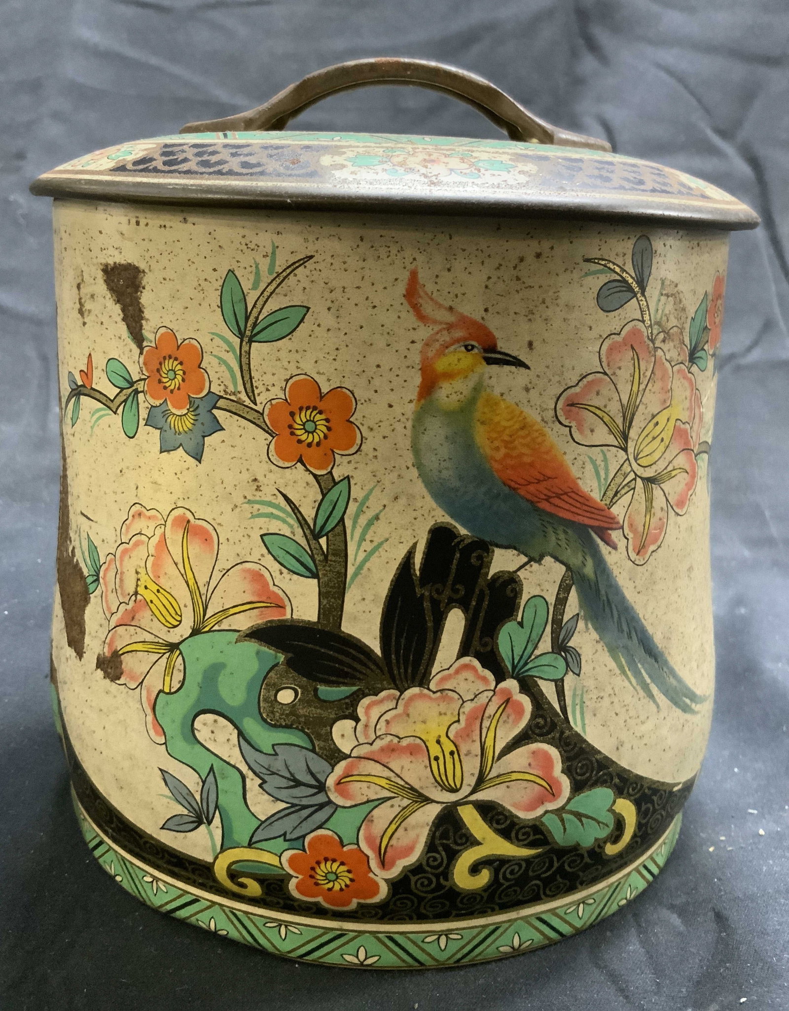 Vintage Asian Floral Detailed Tin W Lid: Tin is vintage. Piece includes lid with handle. Tin has intricate multi toned floral, leaf and bird detail. Piece measures approximately 5.5 inches tall 5.25 inches wide. Vintage tin, Asian tin, vesse