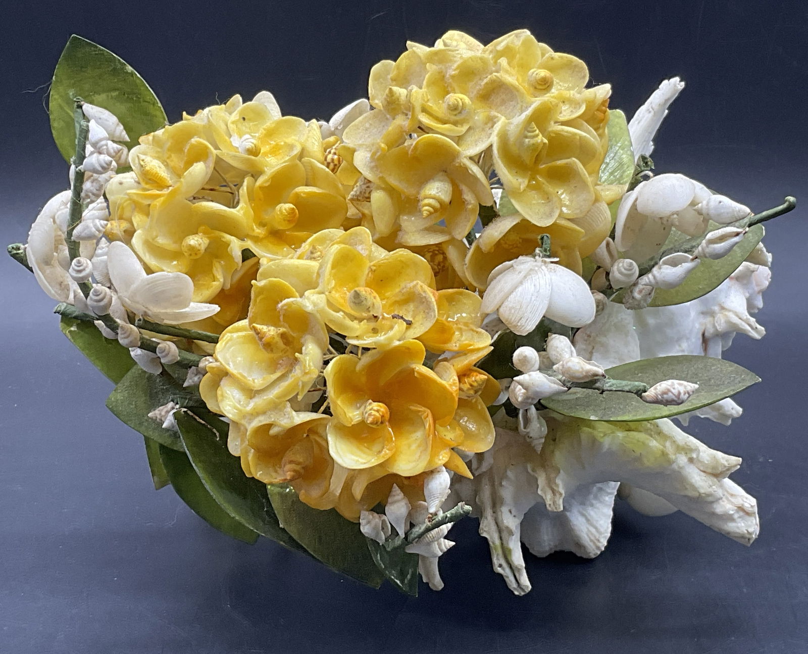 Handmade Multi Shell Nautical Sculpture: Handmade Multi Shell Nautical Arrangement Sculpture. Yellow, green, and off white hues. Measures approx. 6H x 8W in. Chipping, cracking, losses, and surface wear present. home decor, home accents, hom