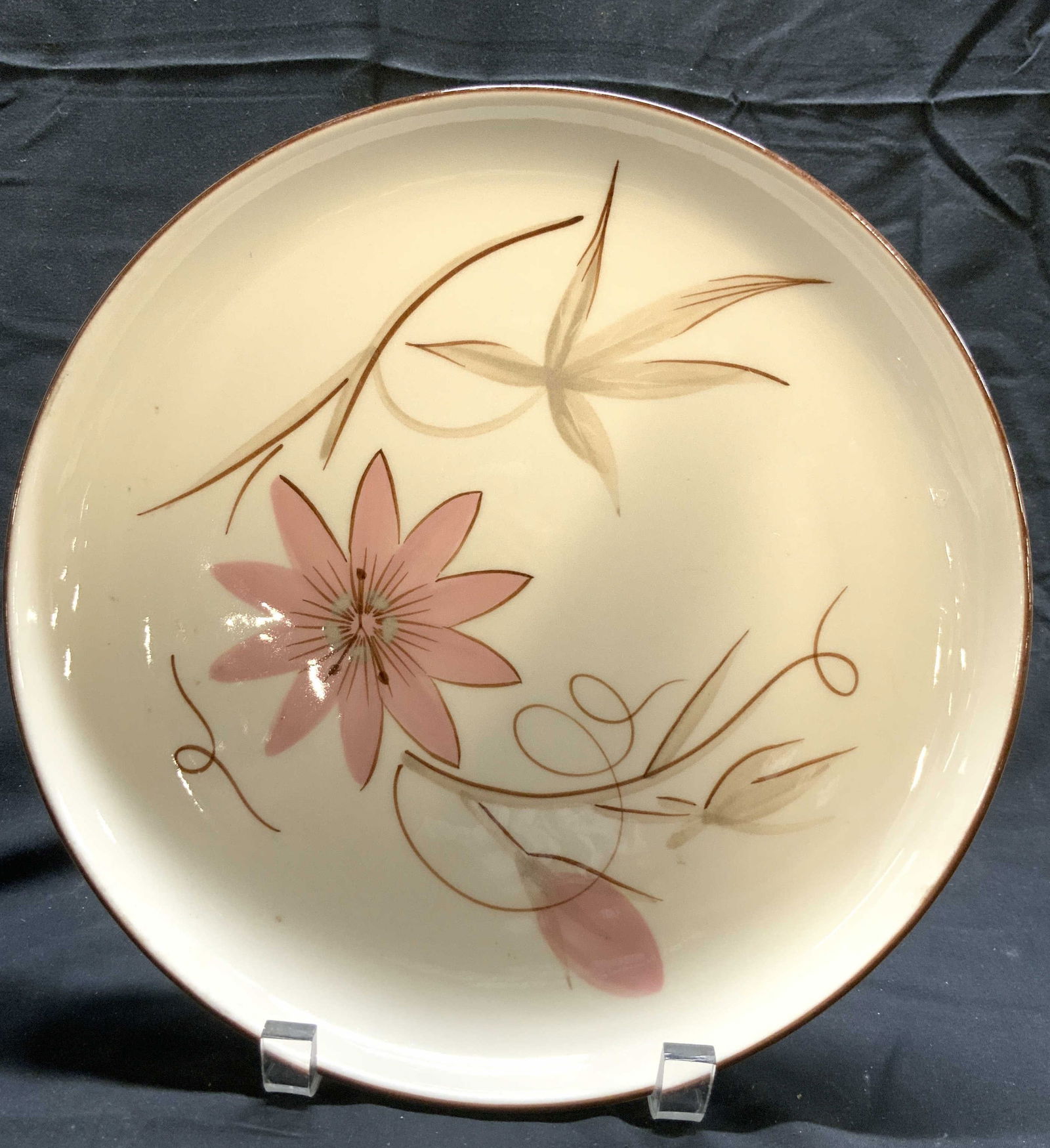 WINFIELD Hand Crafted Floral Porcelain Plate: Underside is marked WINFIELD HAND CRAFTED. Plate is porcelain. OIECE has multi toned floral and leaf detail. Plate has brown toned rim. Piece measures approximately 10.25 inches diameter. Plate, porce