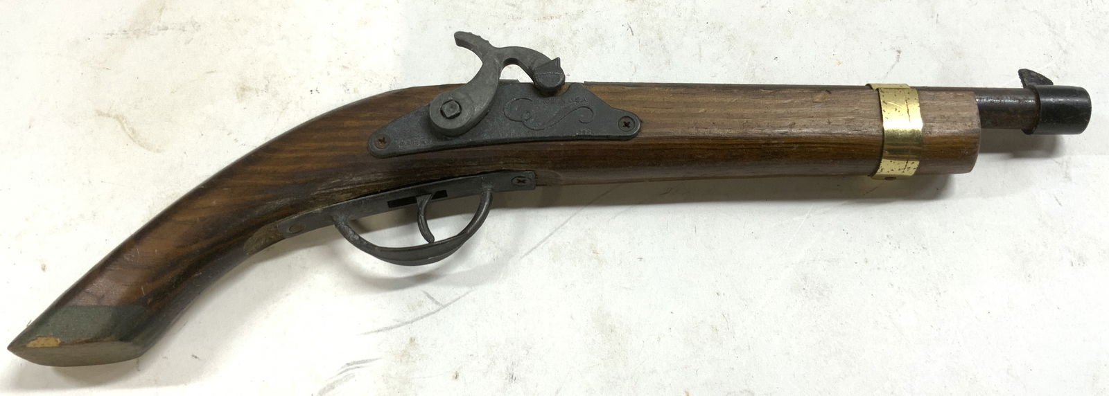 1960s PARRIS FLINTLOCK Vntg Wood & Metal Cap Gun: Metal area reads PARRIS MADE IN USA. Piece crafted from wood and metal. Cap gun/ gun replica is vintage. Piece has gilt metal structure near front of barrel. Piece measures approximately 14.25 inches