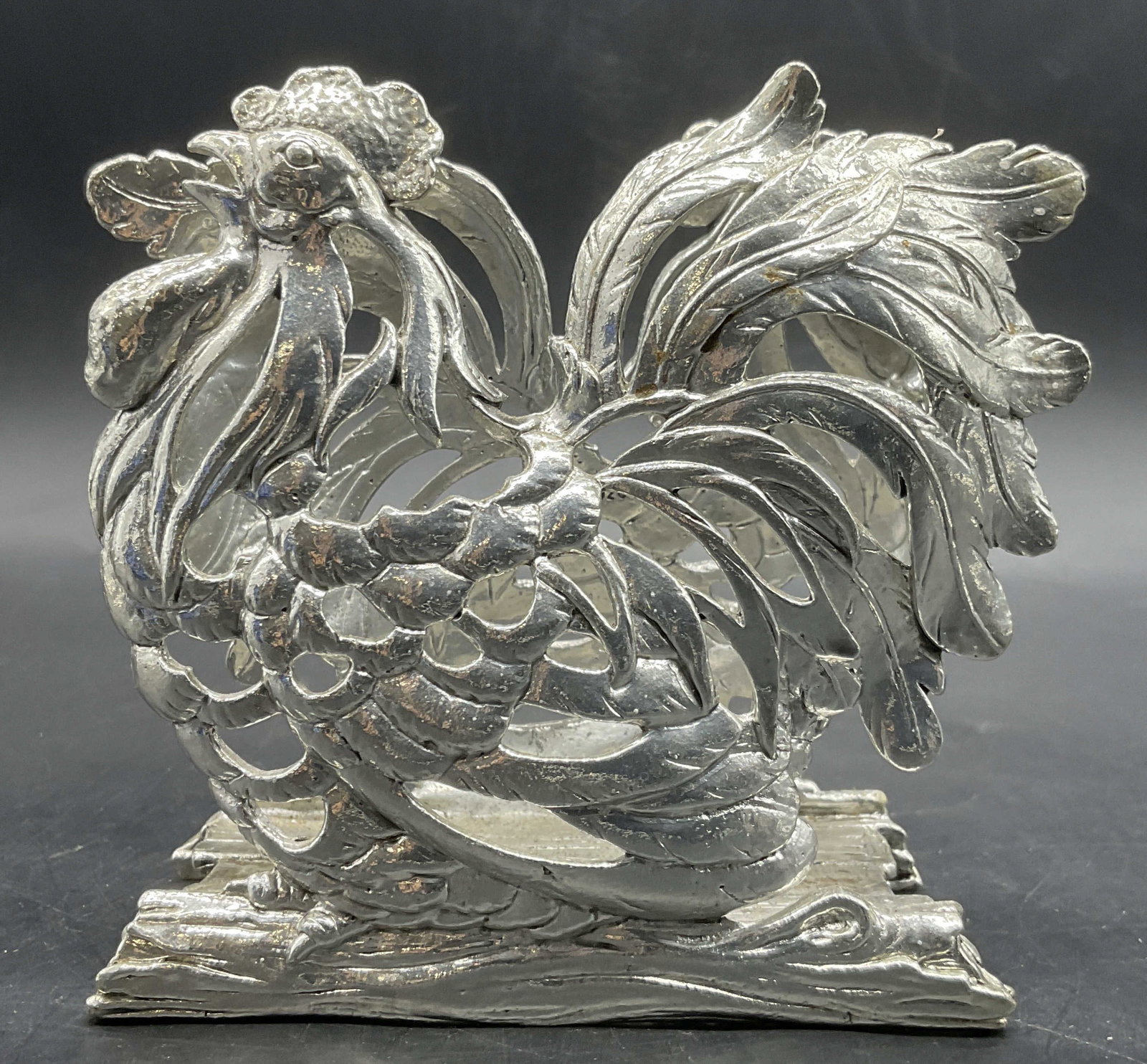 Vintage Silver Tone Metal Rooster Napkin Holder: Vintage Silver Tone Metal Rooster Napkin Holder / Paper Organizer. Measures approx. 4H x 4.25W in. Surface wear consistent with age, use, and exposure. Cracking present. home decor, home accents, home