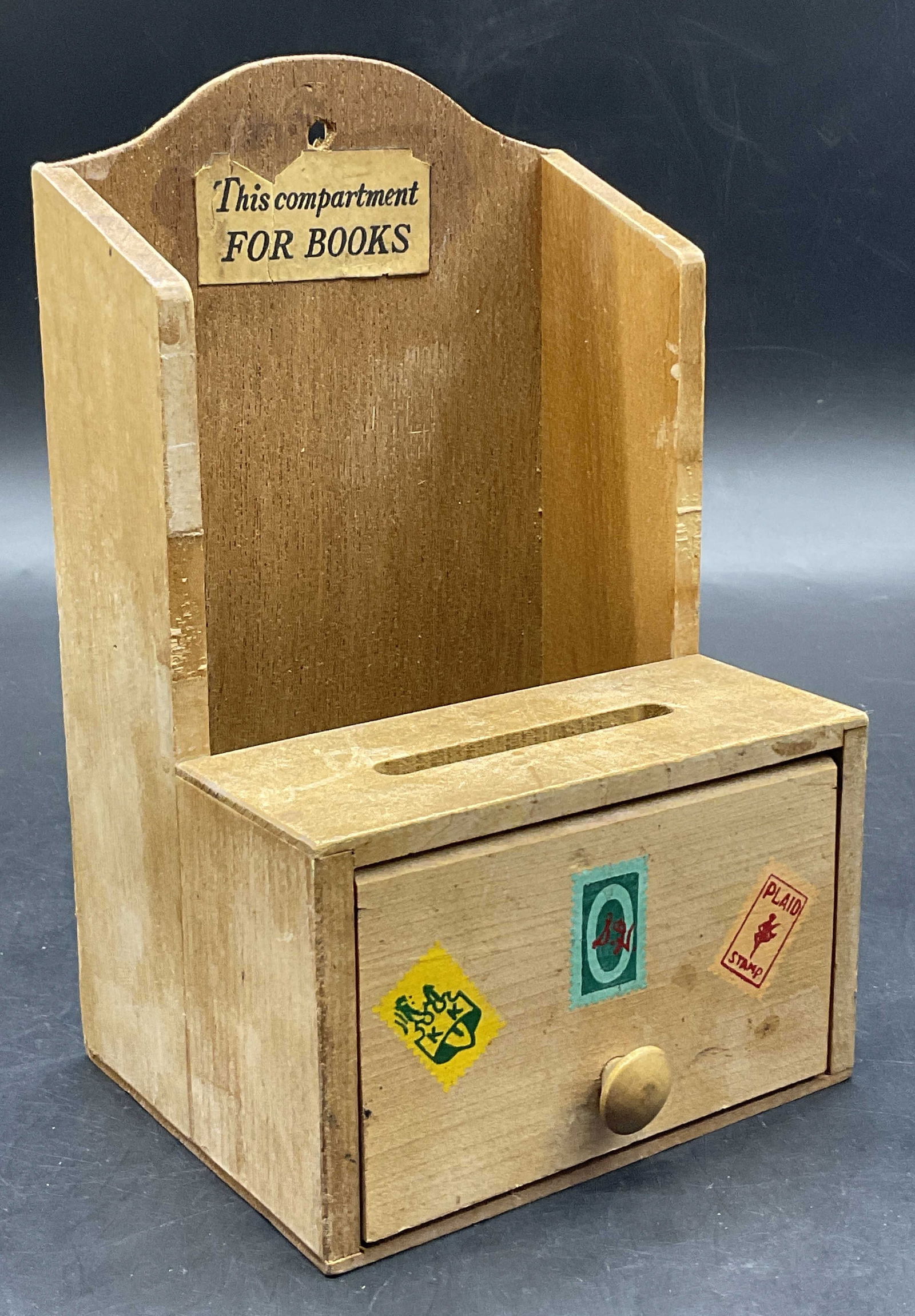 WTC Vintage Trading Stamp Saver Wall Hanging: WTC Vintage Wooden Trading Stamp Saver Wall Hanging. Sticker reads This Compartment For Books. Images of stamps to the door which opens to reveal storage. Measures approx. 6.75H x 4.25W in. Sticker to