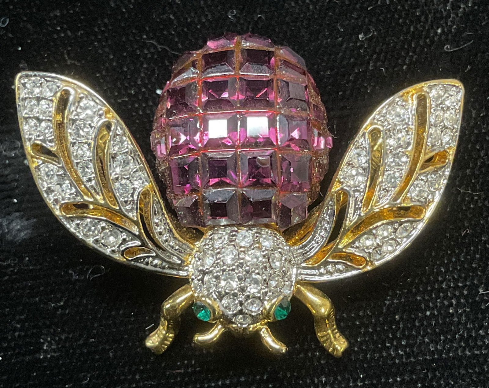 Vintage Gold Tone Crystal Fly Brooch: Vintage gold tone fly brooch with colorless, red, and green crystal. Measures approx 1 x 1.5 inches. Some wear including scratching observed. Jewelry, estate jewelry, costume jewelry, cocktail jewelry