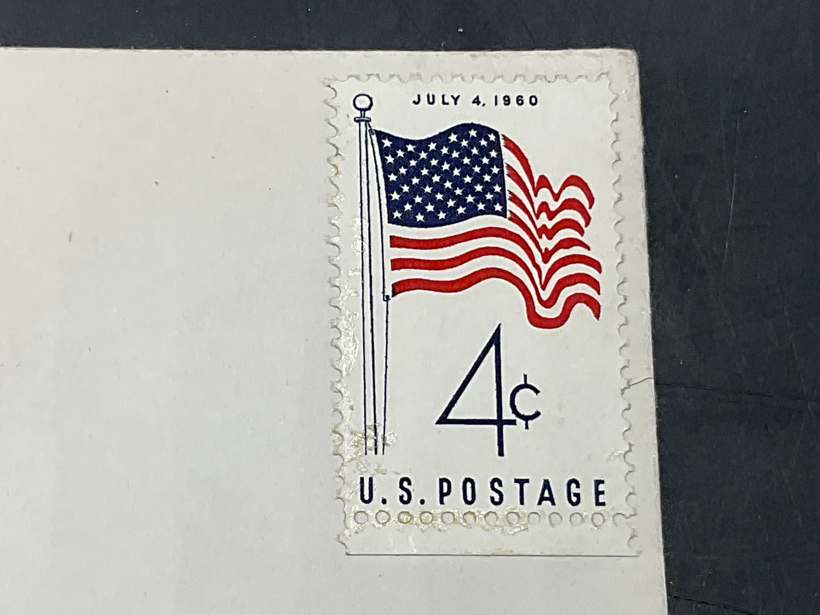 July 4th 1960 American Flag Stamp W/ Envelope: July 4th 1960 American Flag Stamp W/ Envelope from Camp TUTO, Greenland, addressed to Louis Weissen in Brooklyn, NY. Measures approx. 6.5W x 4L in. Surface wear, discoloration, and losses present. Vin