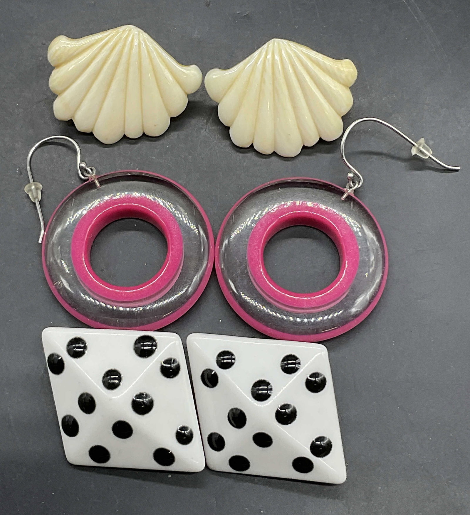 Lot 3 Vintage Geometric Form Earrings: Lot 3 Vintage Geometric Form Earrings. Crafted from resinous material or hard plastic material. Bone style shell form earrings, pink & clear open disk earrings, and black & white spotted earrings. Bac