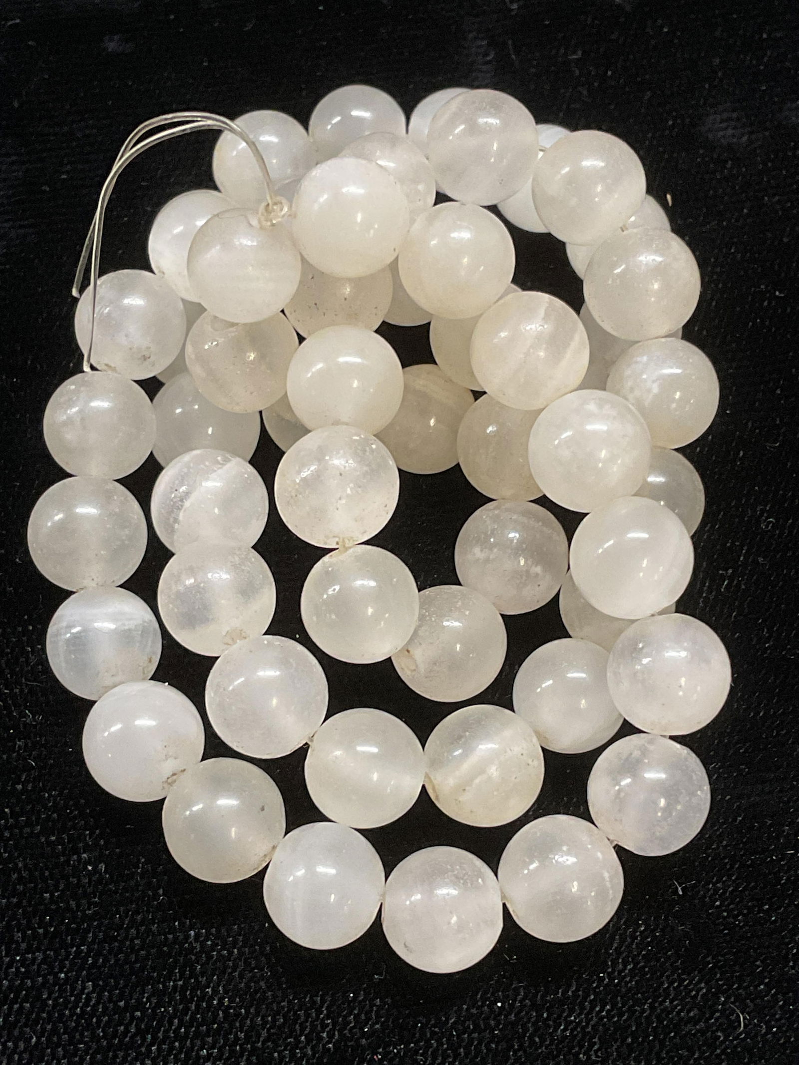 Opaque White Semiprecious Stone Beads: Strand of opaque white semiprecious stone beads. Beads approx .25 wide. Some wear including scratching observed. Jewelry, estate jewelry, fine jewelry, cocktail jewelry, fashion jewelry, accessories,