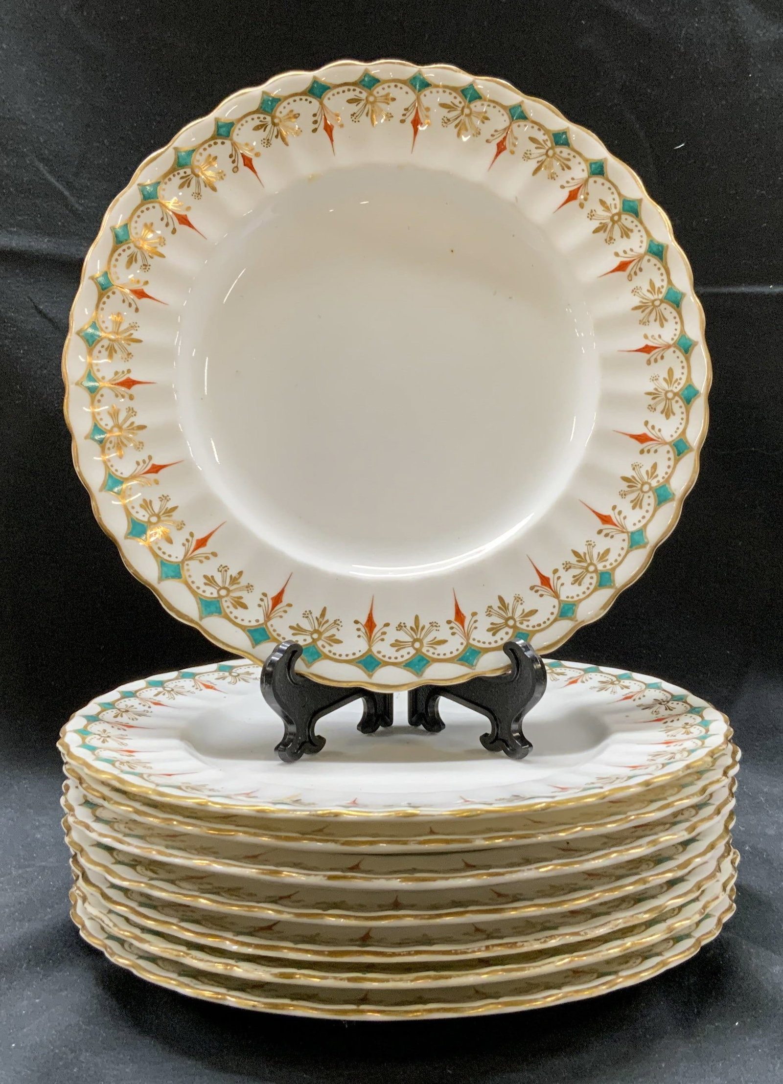 Set 8 Gilt White Porcelain Plates: Set of 8 White Porcelain Plates. Gilt decoration, red and green decorations on borders. Measurements: 7.1 in. Some loss of paint on borders, chips on all plates and crazing. White Porcelain Plates, Ho