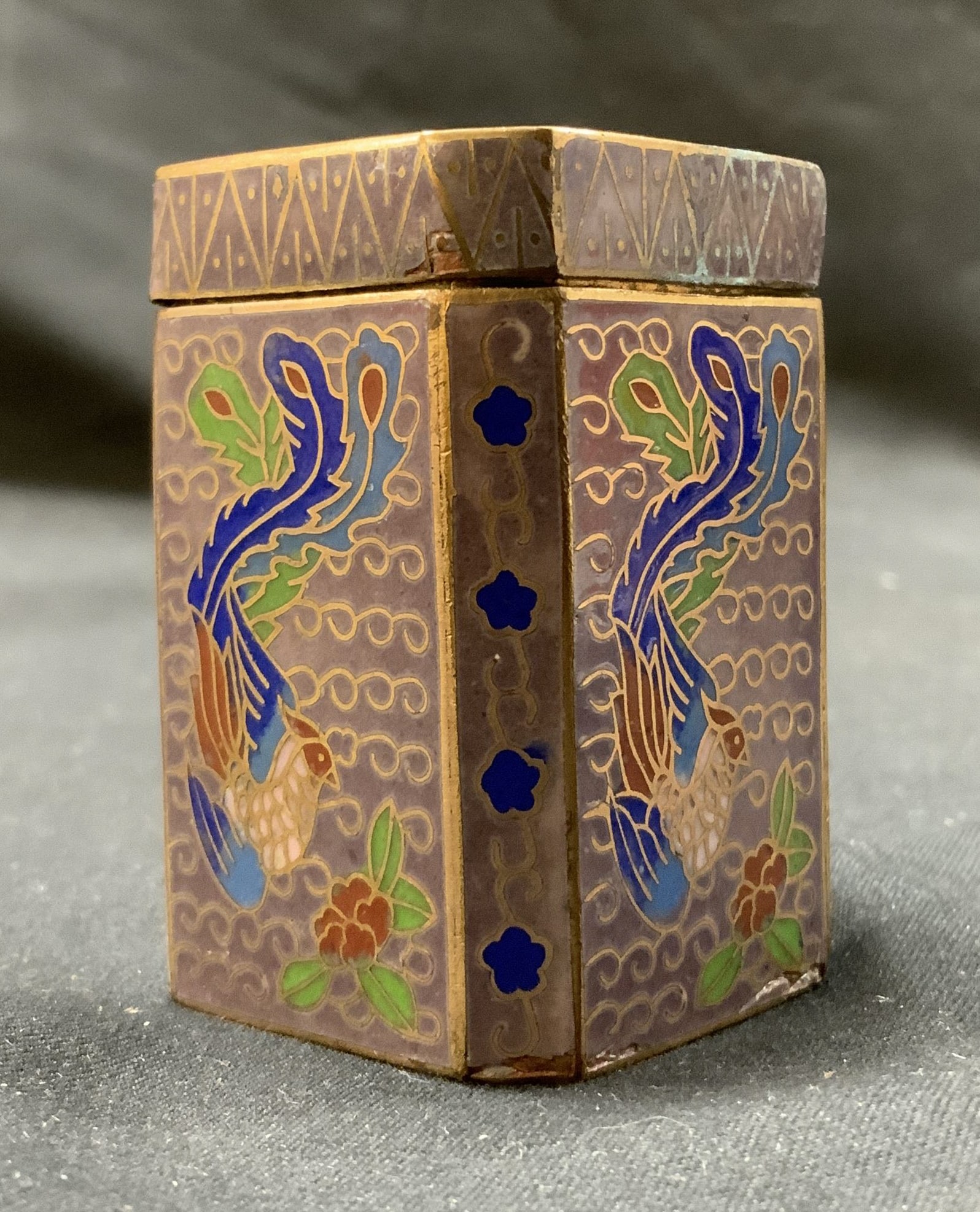 Vintage Chinese Bird Trinket Box: Vintage Chinese Bird Trinket Box Has a bird design throughout trinket box, multicolored with green, blue, red. Visible wear and tear on box, discoloration as well. Some residue in interior. Measuremen