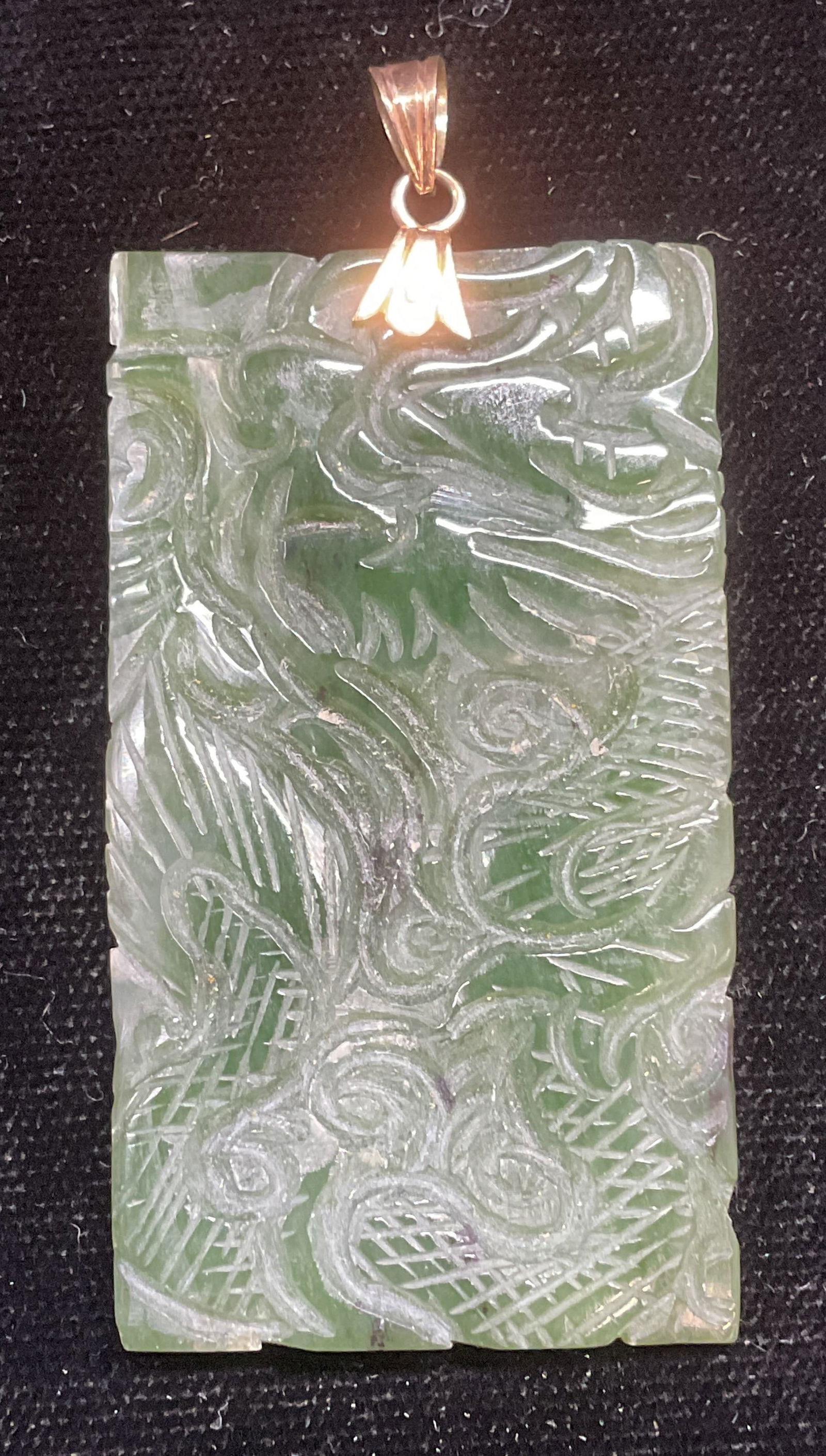 Vintage Carved Jade Dragon Pendant: Vintage hand carved Asian jade dragon motif pendant. Measures approx 2 x 1.25 inches. Some wear including scratching observed. Jewelry, estate jewelry, fine jewelry, cocktail jewelry, fashion jewelry,