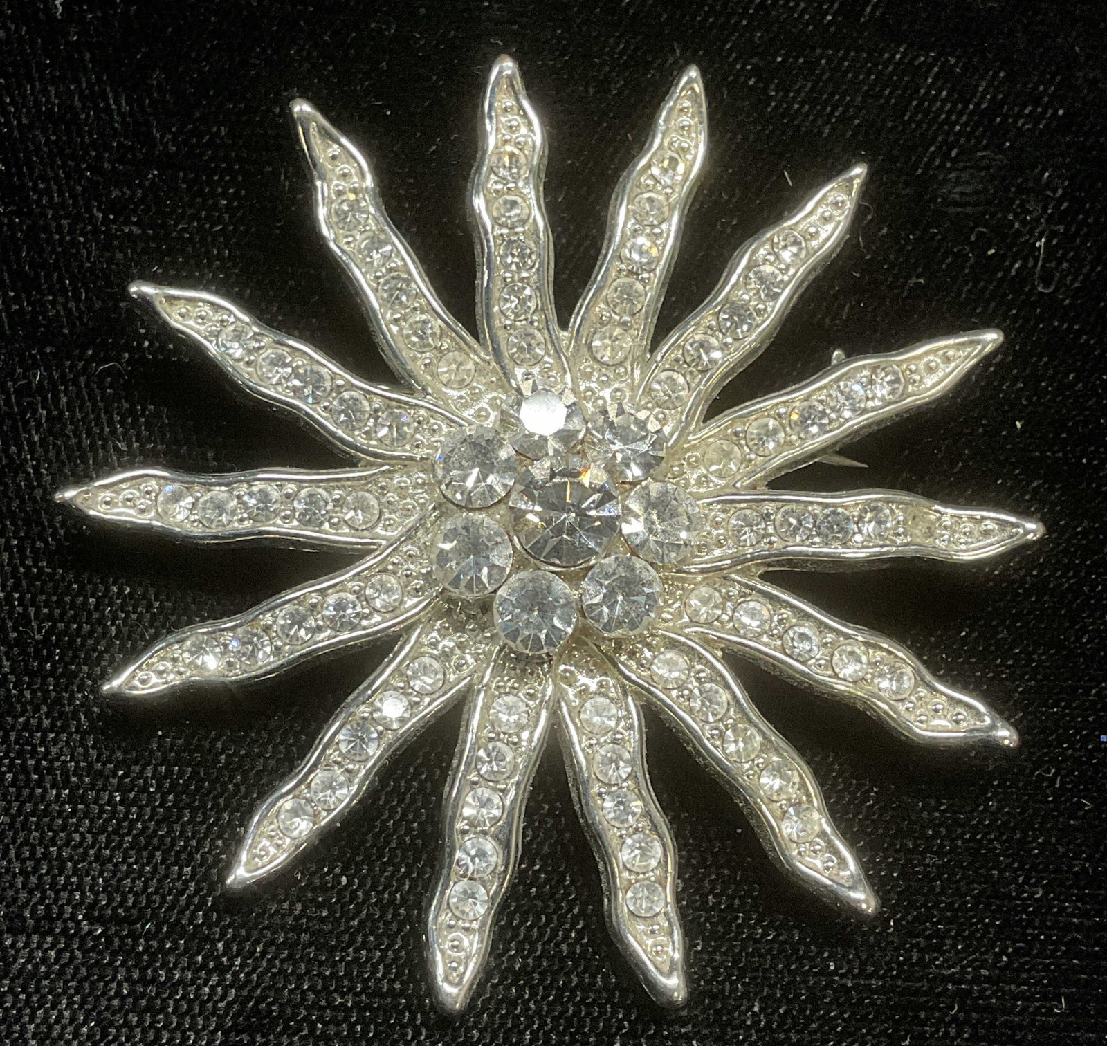 Vintage Silver Tone Crystal Flower Brooch: Silver tone flower motif brooch with crystal decoration. Measures approx 2 inches wide. Some wear including scratching. Jewelry, costume jewelry, estate jewelry, fashion jewelry, cocktail jewelry, acc