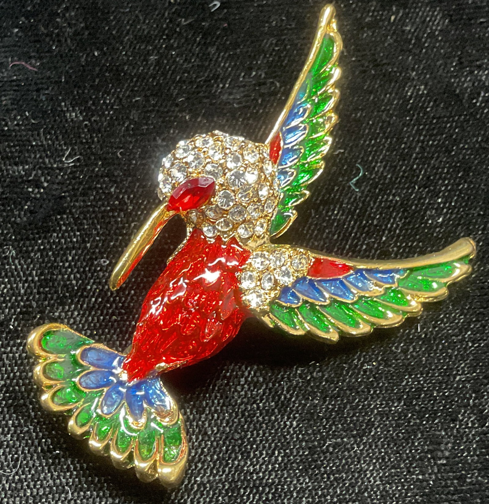 Gold Tn Enamel Crystal Hummingbird Brooch: Gold tone multicolor enamel and crystal decorated hummingbird motif brooch. Measures approx 2 x 1.5 inches. Some wear including scratching. Jewelry, costume jewelry, estate jewelry, fashion jewelry, c
